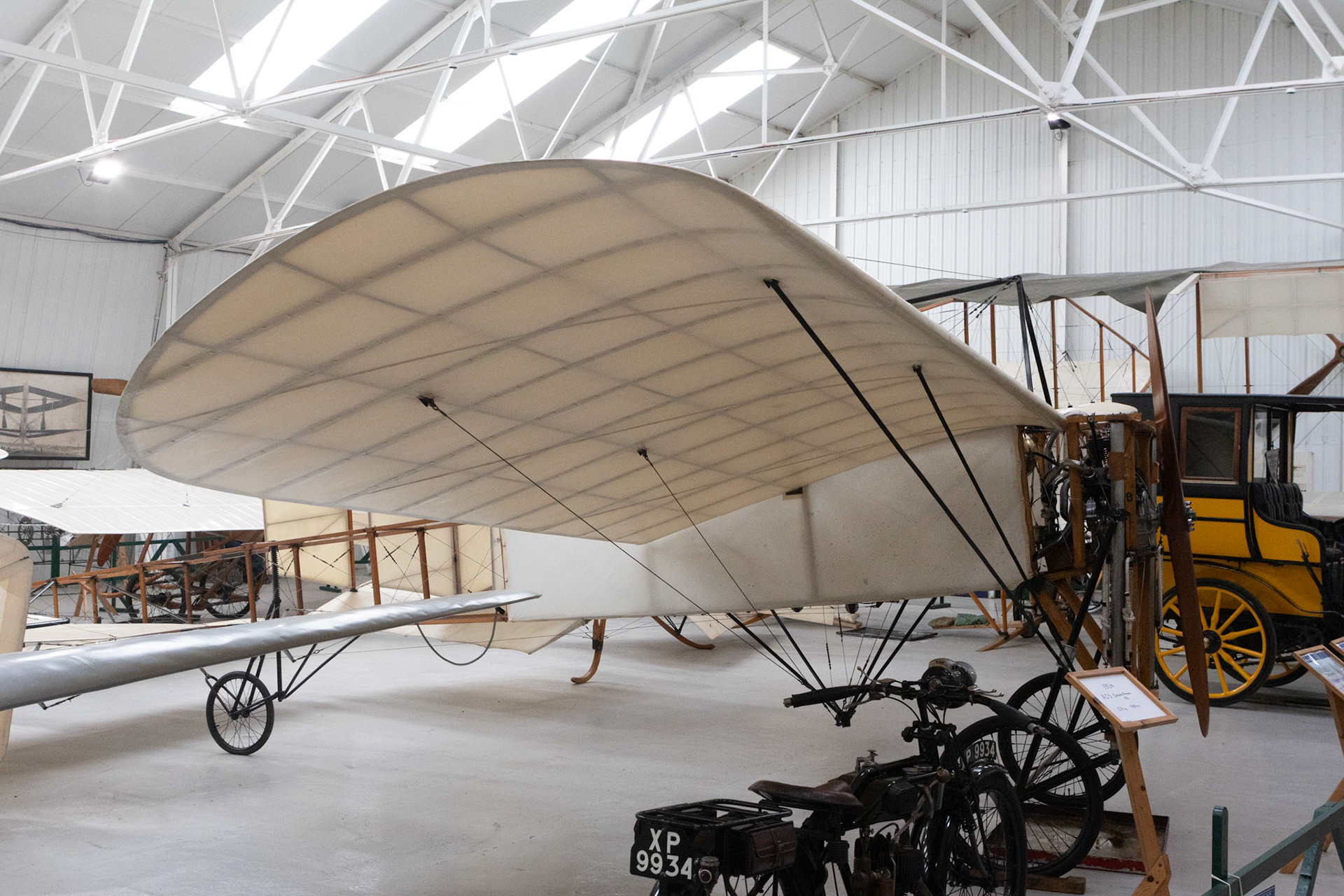 The first really successful Blériot, the Type XI has a wooden fuselage frame braced with supporting struts and tension wires and is only partially fabric covered. The wings, also of wooden construction and fabric covered, include control wires to enable them to be warped for lateral control. They are mounted at shoulder level to the fuselage and braced below by wires from the undercarriage and above to a tubular frame located in front of the cockpit.