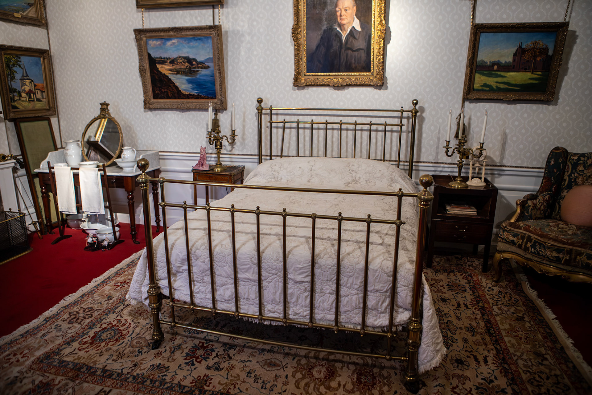 Birth-bed of Winston Churchill - Blenheim Palace is a country house in Woodstock, Oxfordshire, England. It is the seat of the Dukes of Marlborough, and the birthplace of Sir Winston Churchill. Originally called Blenheim Castle, it has been known as Blenheim Palace since the 19th century. One of England's largest houses, it was built between 1705 and 1722, and was designated a UNESCO World Heritage Site in 1987