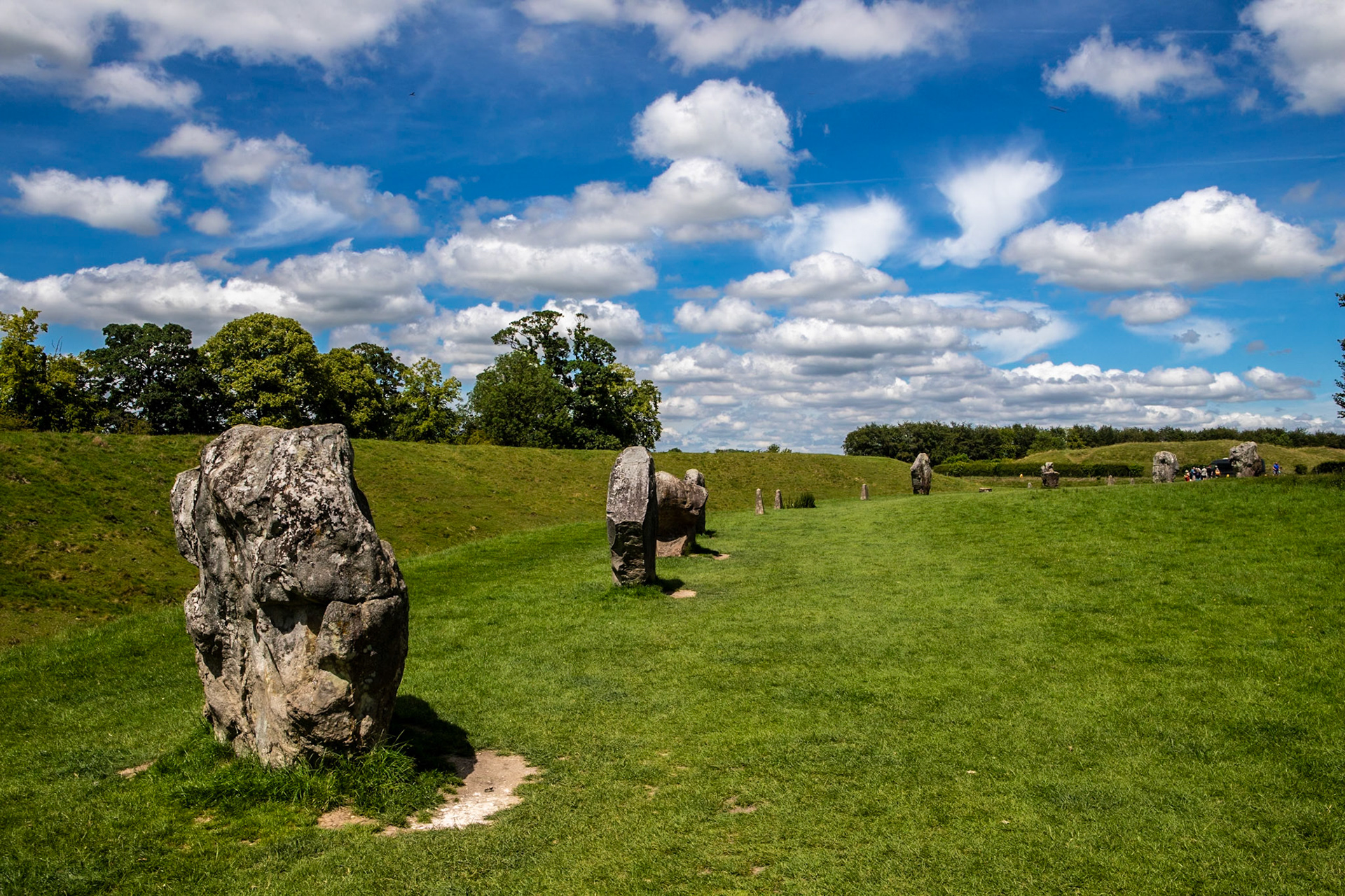 Avebury is a Neolithic henge monument containing three stone circles, around the village of Avebury in Wiltshire, in south-west England. One of the best-known prehistoric sites in Britain, it contains the largest megalithic stone circle in the world.