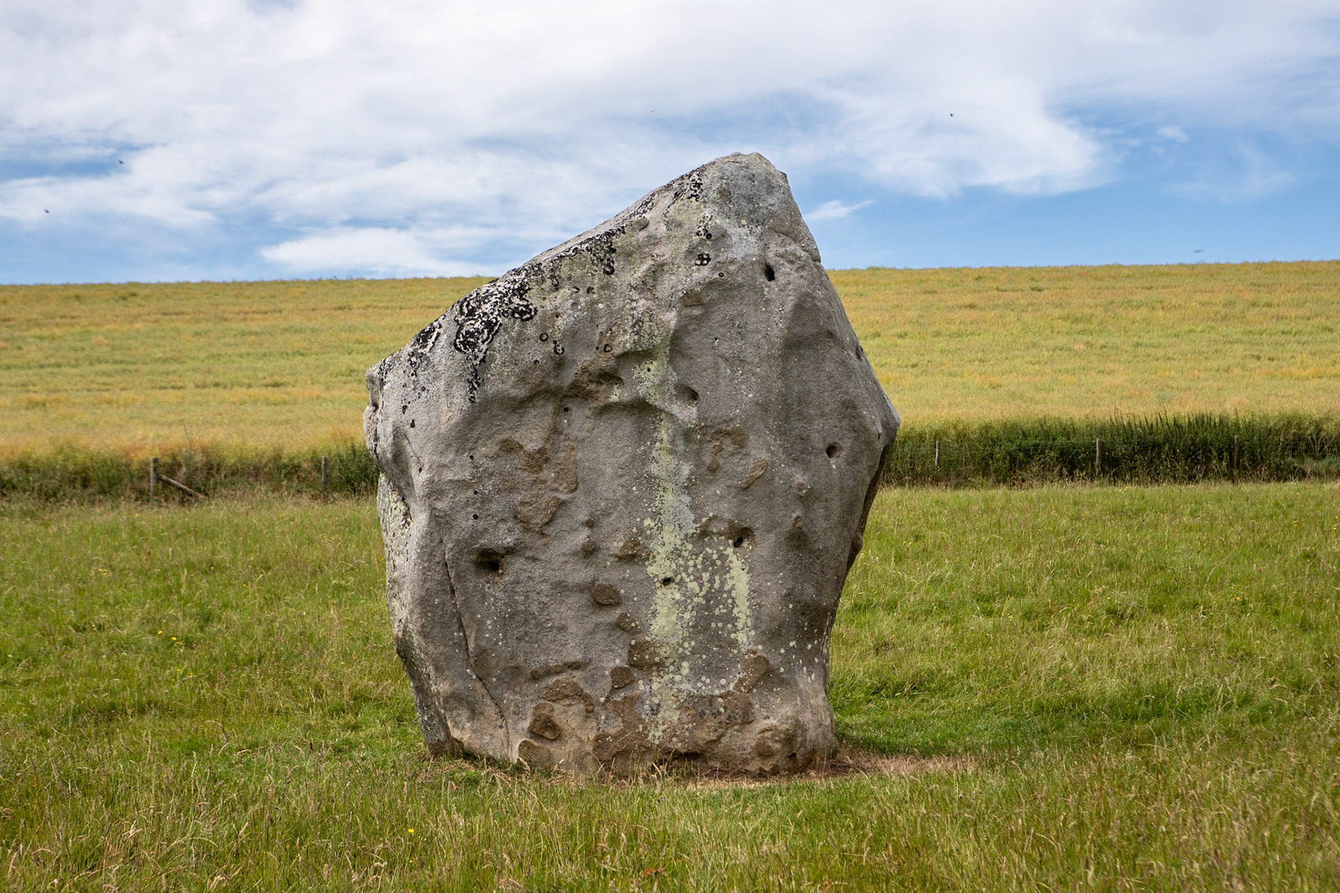 Avebury is a Neolithic henge monument containing three stone circles, around the village of Avebury in Wiltshire, in south-west England. One of the best-known prehistoric sites in Britain, it contains the largest megalithic stone circle in the world.