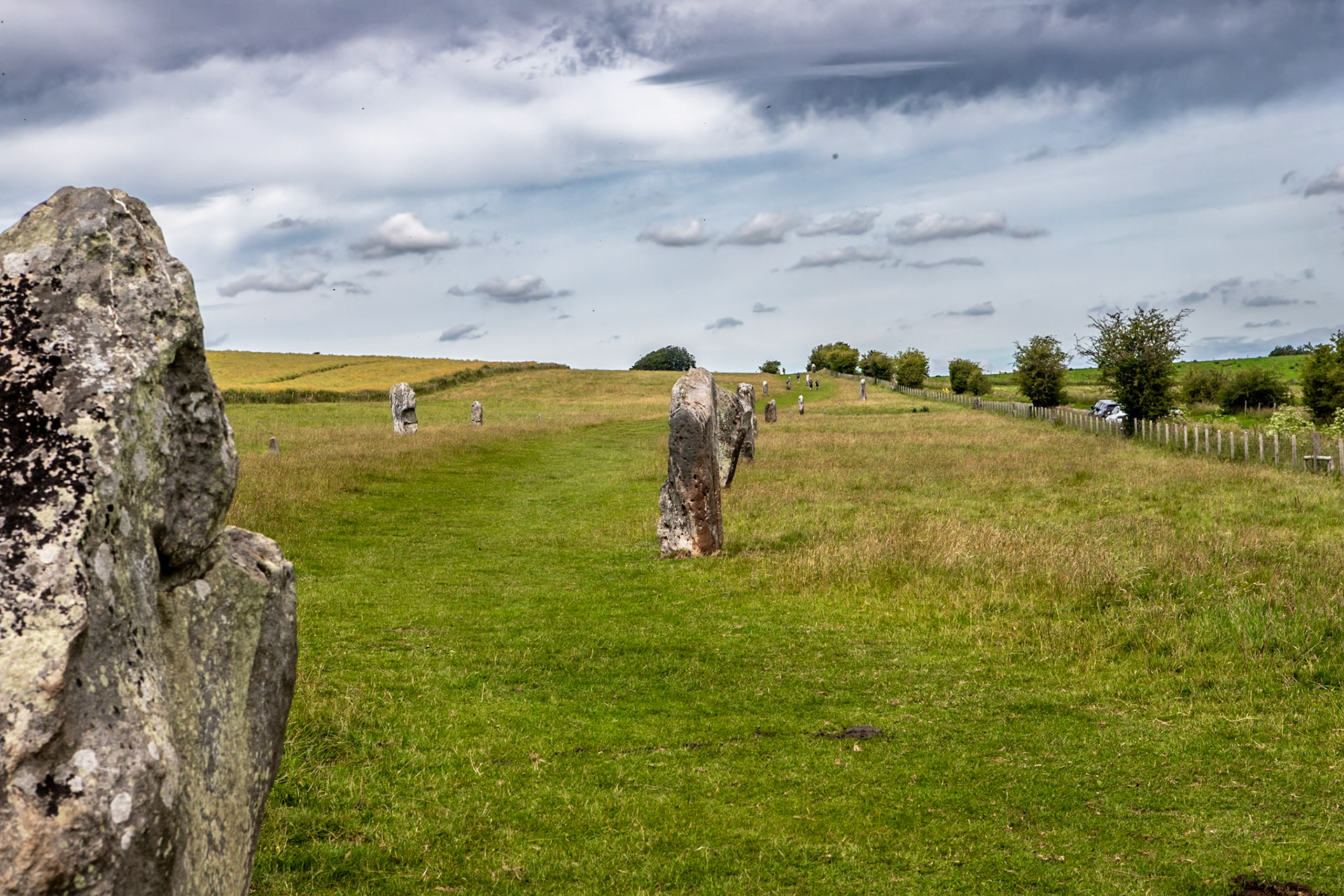 Avebury is a Neolithic henge monument containing three stone circles, around the village of Avebury in Wiltshire, in south-west England. One of the best-known prehistoric sites in Britain, it contains the largest megalithic stone circle in the world.