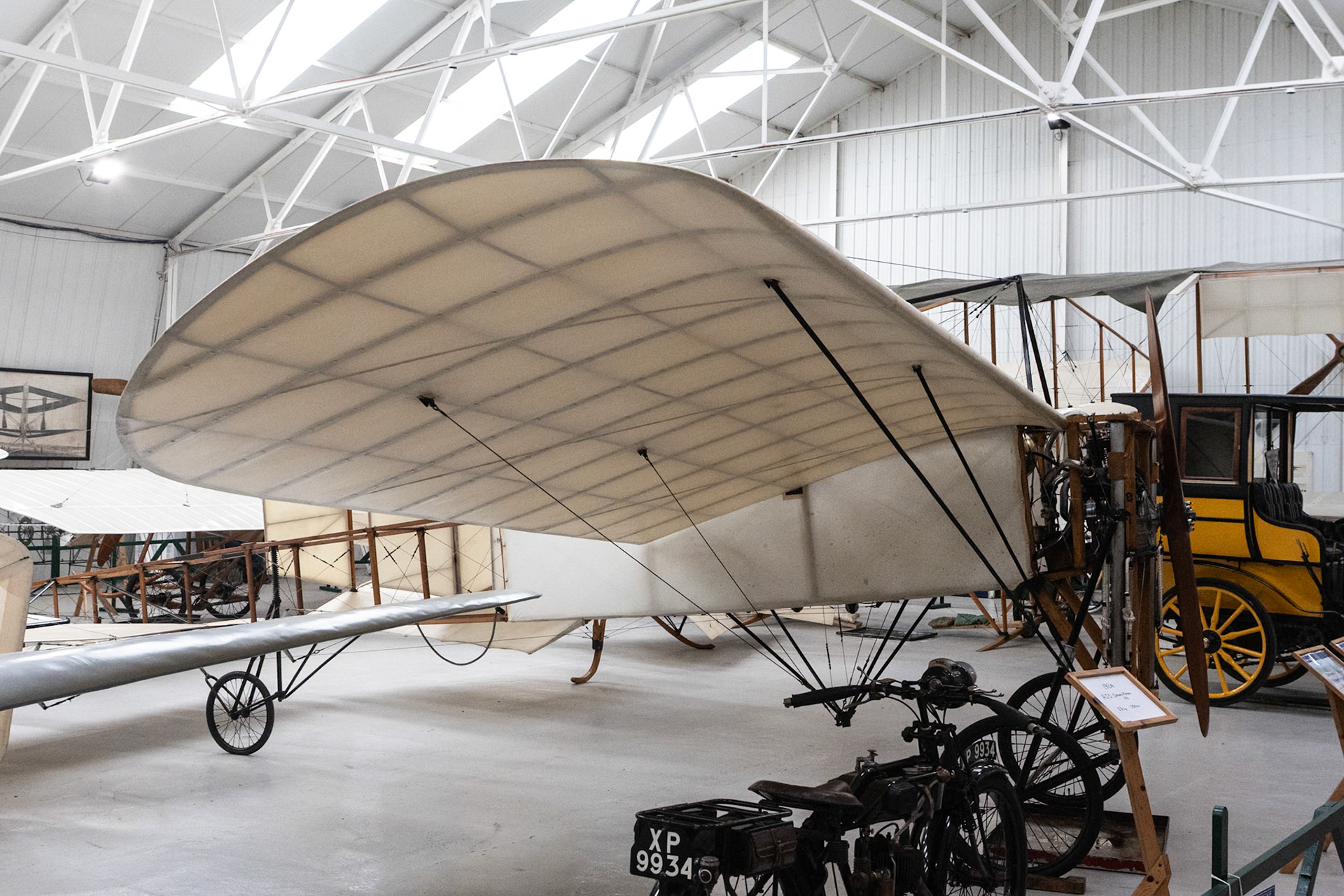 The first really successful Blériot, the Type XI has a wooden fuselage frame braced with supporting struts and tension wires and is only partially fabric covered. The wings, also of wooden construction and fabric covered, include control wires to enable them to be warped for lateral control. They are mounted at shoulder level to the fuselage and braced below by wires from the undercarriage and above to a tubular frame located in front of the cockpit.