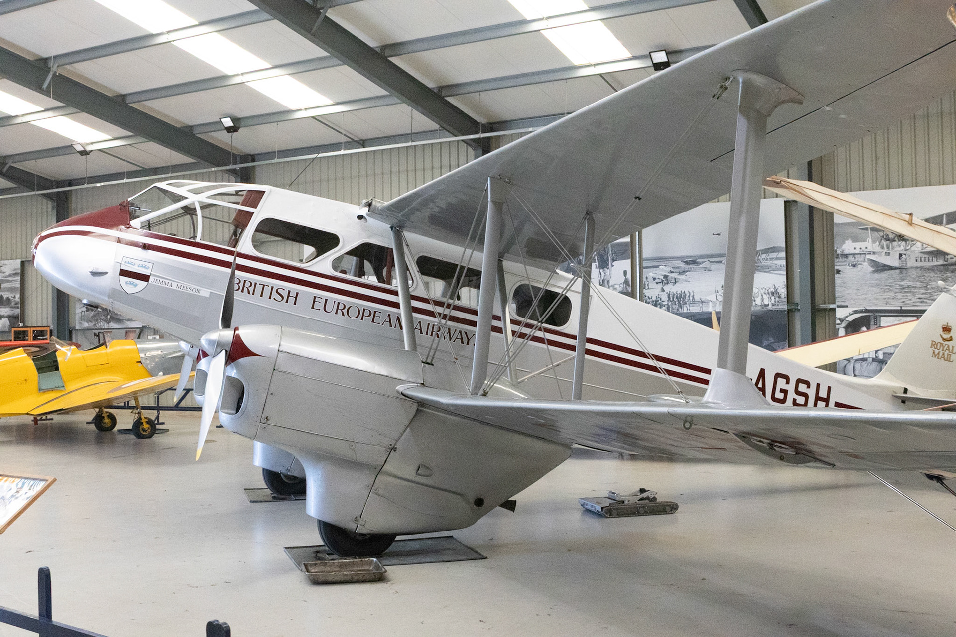 The de Havilland DH.89 Dragon Rapide is a 1930s short-haul biplane airliner developed and produced by British aircraft company de Havilland. Capable of accommodating 6–8 passengers, it proved an economical and durable craft with its strong lightweight plywood construction.Developed during the early 1930s, the Dragon Rapide was essentially a smaller, twin-engined version of the four-engined DH.86 Express, and shared a number of common features, such as its tapered wings, streamlined fairings and Gipsy Six engines. First named the "Dragon Six", the type was marketed as "Dragon Rapide" and later simply known as the "Rapide". Upon its introduction in summer 1934, it proved to be a popular aircraft with airlines and private civil operators alike, attaining considerable foreign sales in addition to its domestic use.