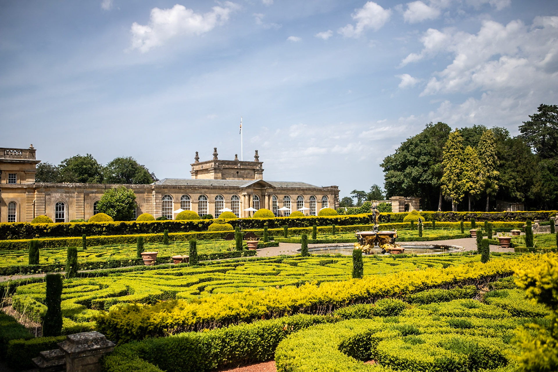 Blenheim Palace is a country house in Woodstock, Oxfordshire, England. It is the seat of the Dukes of Marlborough, and the birthplace of Sir Winston Churchill. Originally called Blenheim Castle, it has been known as Blenheim Palace since the 19th century. One of England's largest houses, it was built between 1705 and 1722, and was designated a UNESCO World Heritage Site in 1987