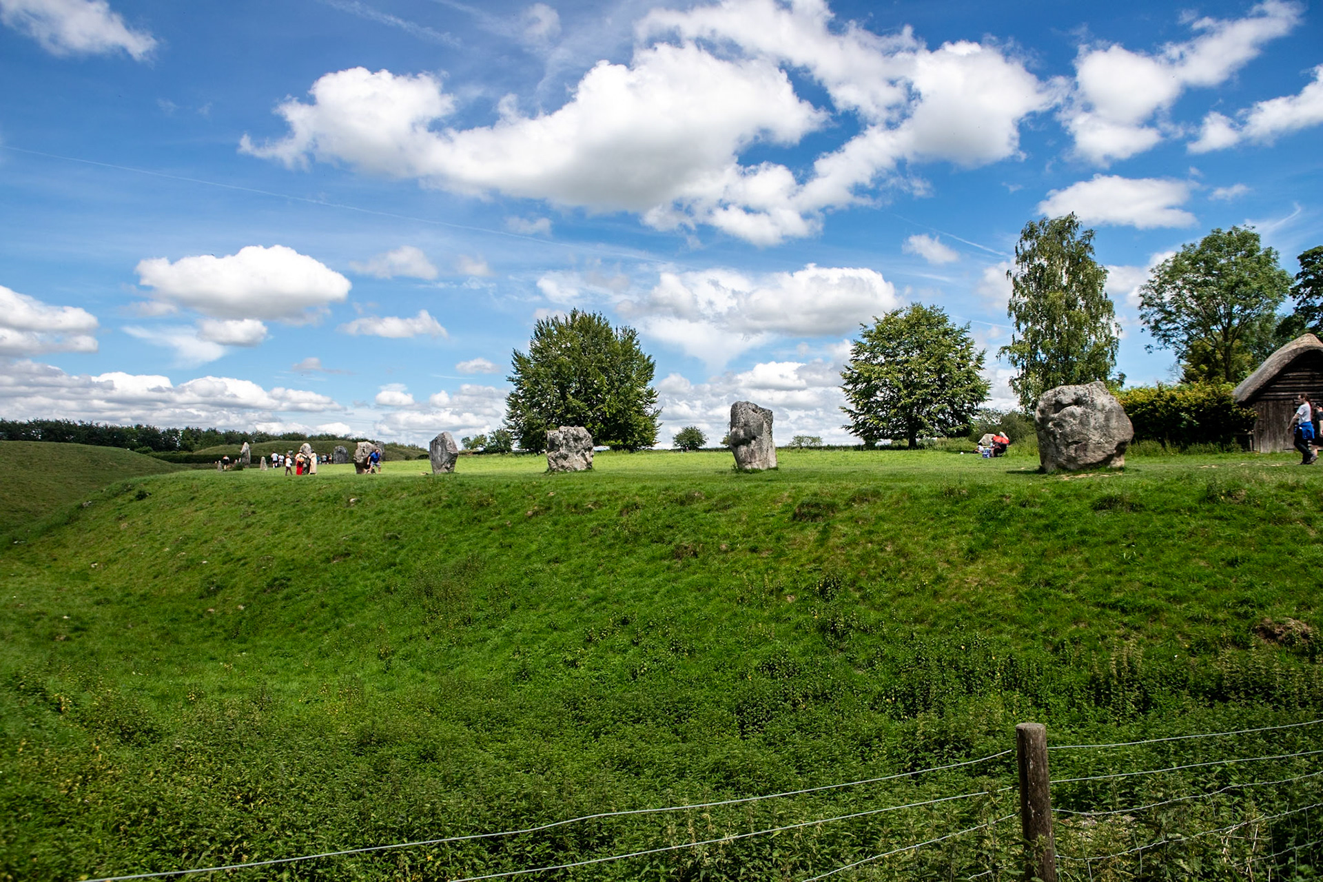 Avebury is a Neolithic henge monument containing three stone circles, around the village of Avebury in Wiltshire, in south-west England. One of the best-known prehistoric sites in Britain, it contains the largest megalithic stone circle in the world.