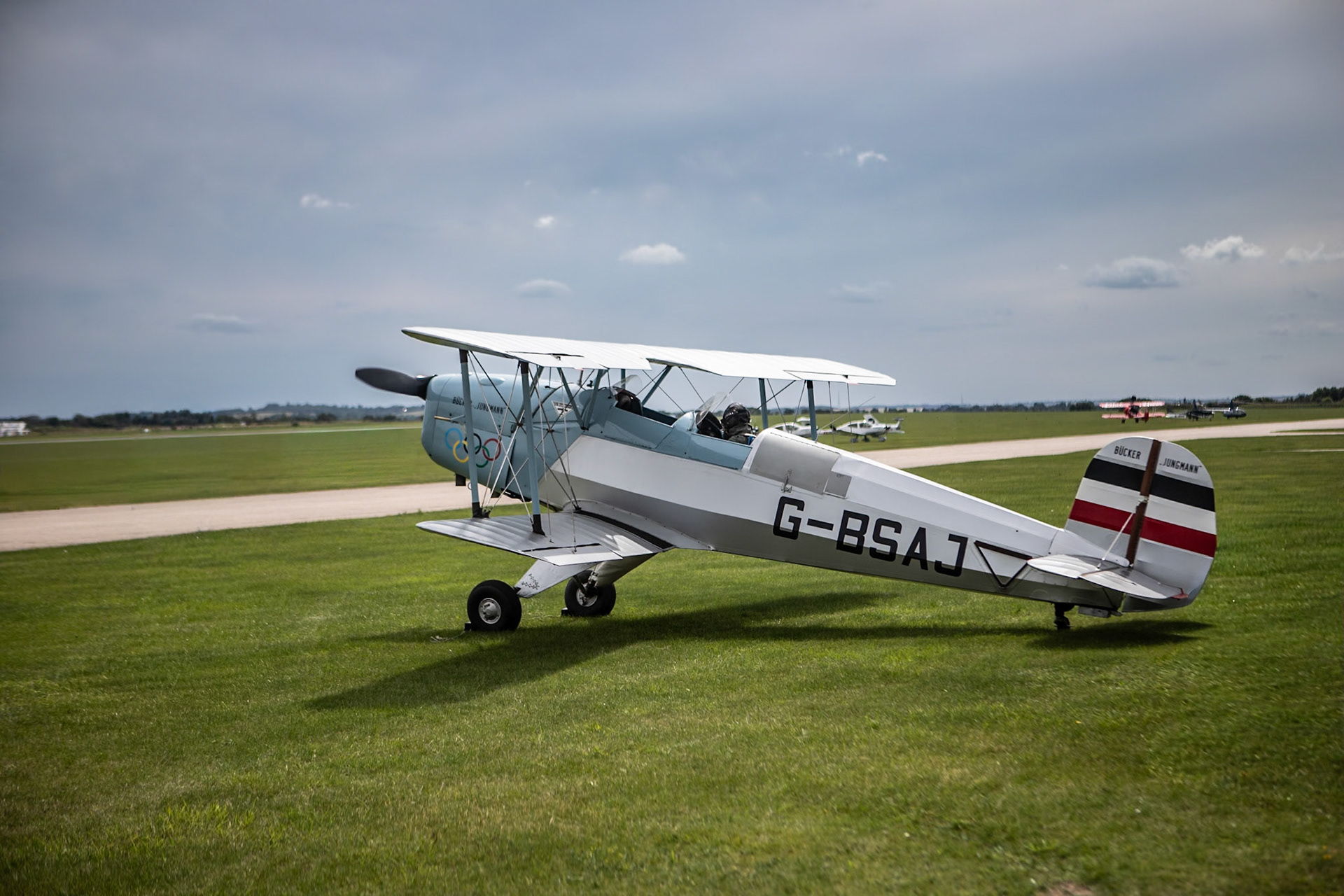 The Bücker Bü 131 Jungmann is a basic biplane trainer aircraft designed and produced by the German aircraft manufacturer Bücker Flugzeugbau. It was the company's first aircraft, as well as being the final biplane to be produced in Germany