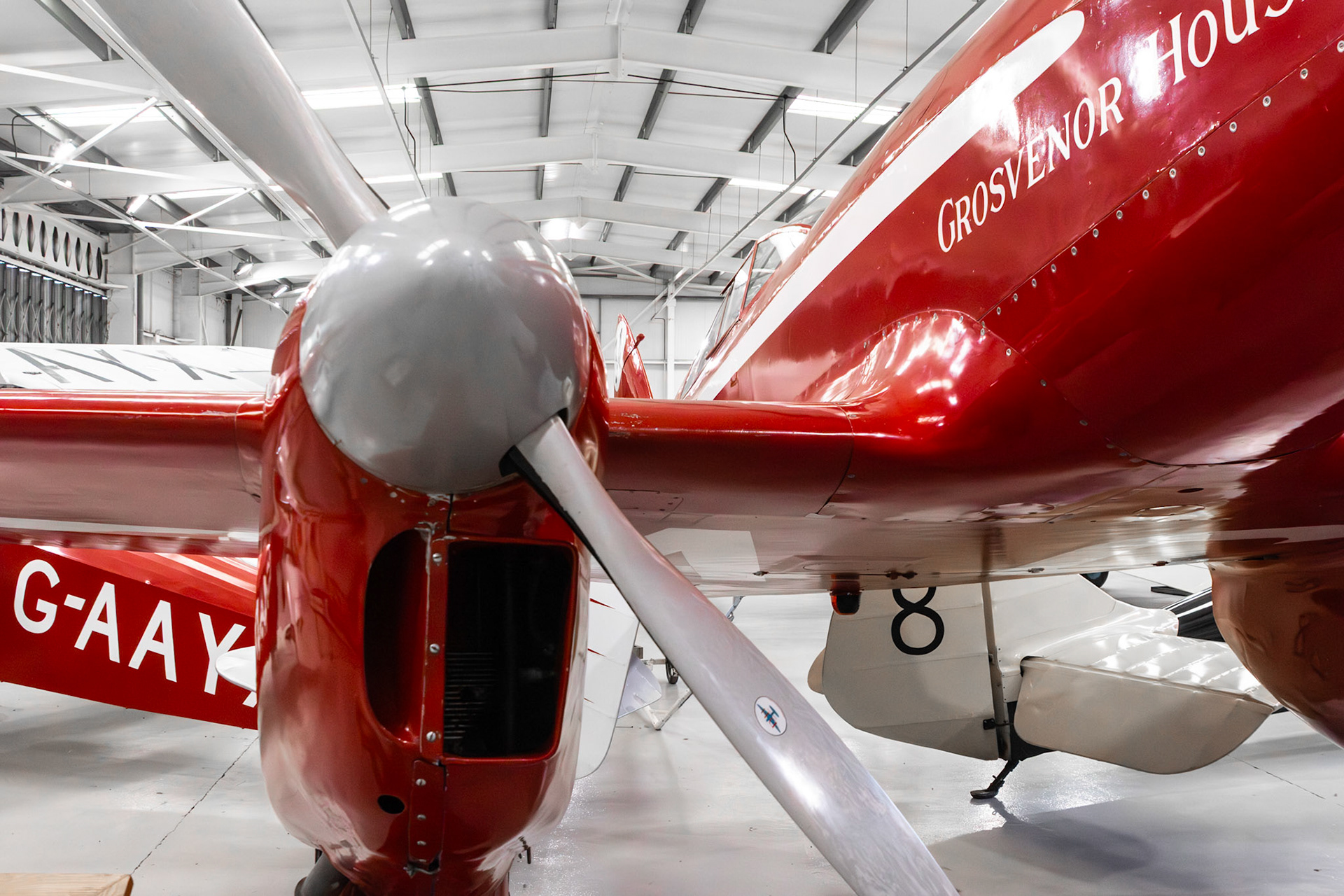 The de Havilland DH.88 Comet is a British two-seat, twin-engined aircraft built by the de Havilland Aircraft Company. It was developed specifically to participate in the 1934 England-Australia MacRobertson Air Race from the United Kingdom to Australia.Development of the Comet was seen as both a prestige project and an entry into the use of modern techniques. It was designed to meet the specific requirements of the race. It was the first British aircraft to incorporate in one airframe all the elements of the modern high speed aircraft - stressed-skin construction, cantilever monoplane flying surfaces, retractable undercarriage, landing flaps, variable-pitch propellers and an enclosed cockpit.Three Comets were produced for the race, all for private owners, at the discounted price of £5,000 per aircraft. The aircraft had a rapid development process, performing its maiden flight only six weeks before the race. Comet G-ACSS Grosvenor House eventually won the race. Another two Comets were built after the race. Comets established many aviation records, both during the race and afterwards, and also took part in further races. Three were bought and evaluated by national governments, typically as mail planes. Two Comets, G-ACSS and G-ACSP, survived while a number of full-scale replicas have also been constructed.