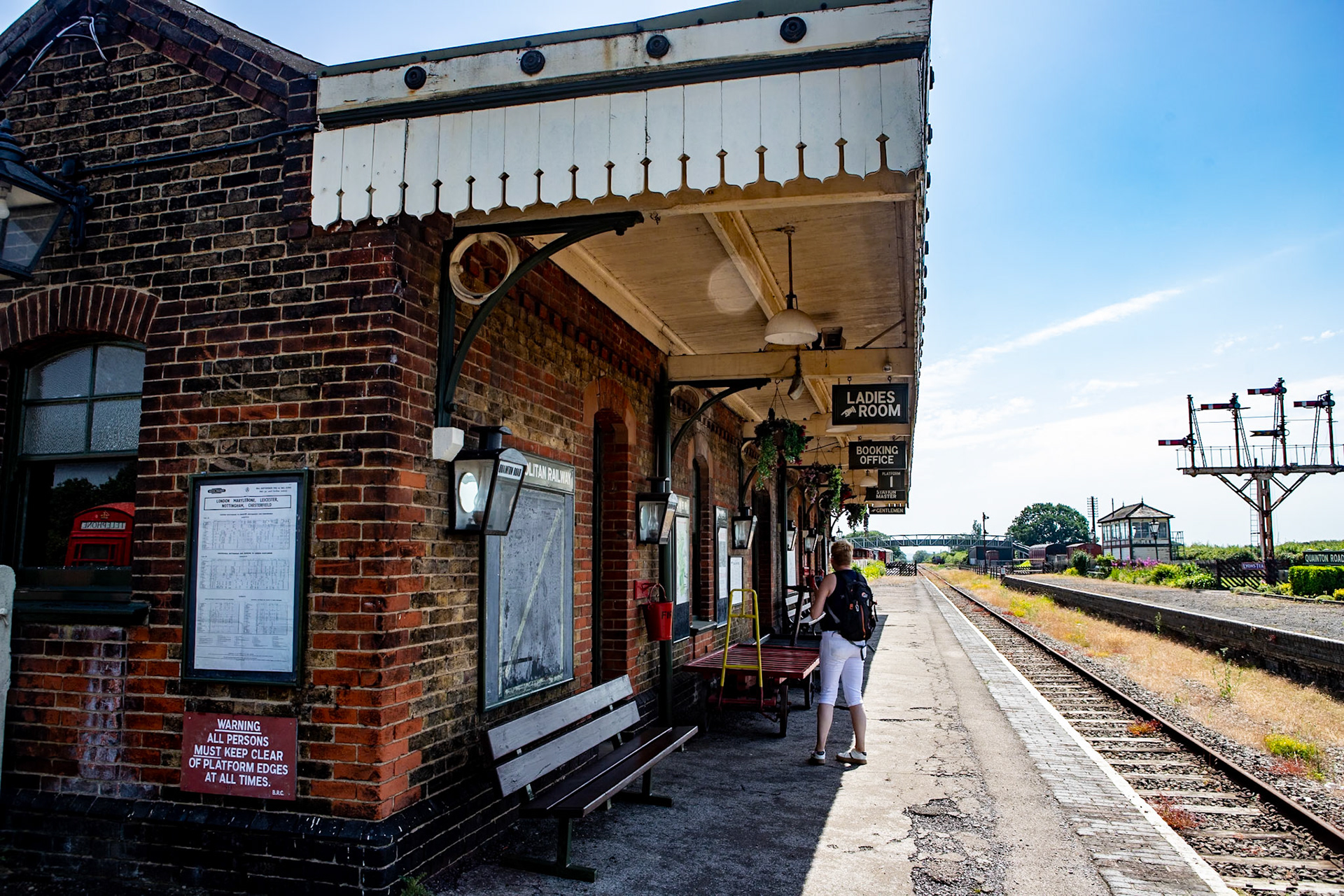 Quainton Road railway station served the area of Quainton, in Buckinghamshire, England; it is sited 44 miles (71 km) from London. Built by the Aylesbury and Buckingham Railway, it was the result of pressure from the 3rd Duke of Buckingham to route the railway near his home at Wotton House and to open a railway station at the nearest point to it. Serving a relatively underpopulated area, Quainton Road was a crude railway station, described as "extremely primitive".