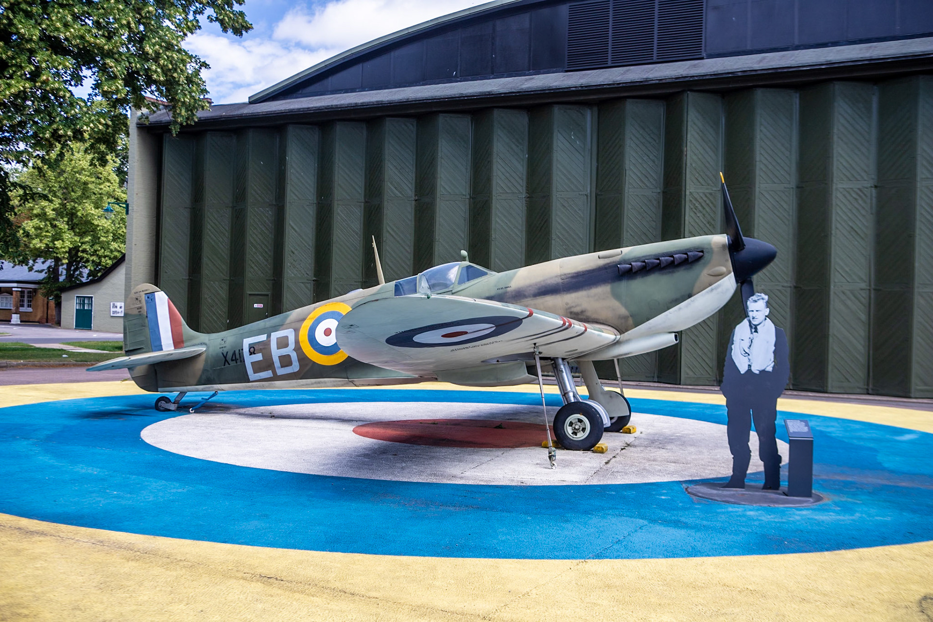 The Supermarine Spitfire is a British single-seat fighter aircraft that was used by the Royal Air Force and other Allied countries before, during, and after World War II. It was the only British fighter produced continuously throughout the war. The Spitfire was a short-range, high-performance interceptor aircraft designed by R. J. Mitchell, chief designer at Supermarine Aviation Works, which operated as a subsidiary of Vickers-Armstrong from 1928. Mitchell modified the Spitfire's distinctive elliptical wing (designed by Beverley Shenstone) with innovative sunken rivets to have the thinnest possible cross-section, achieving a potential top speed greater than that of several contemporary fighter aircraft, including the Hawker Hurricane. Mitchell continued to refine the design until his death from cancer in 1937, whereupon his colleague Joseph Smith took over as chief designer.