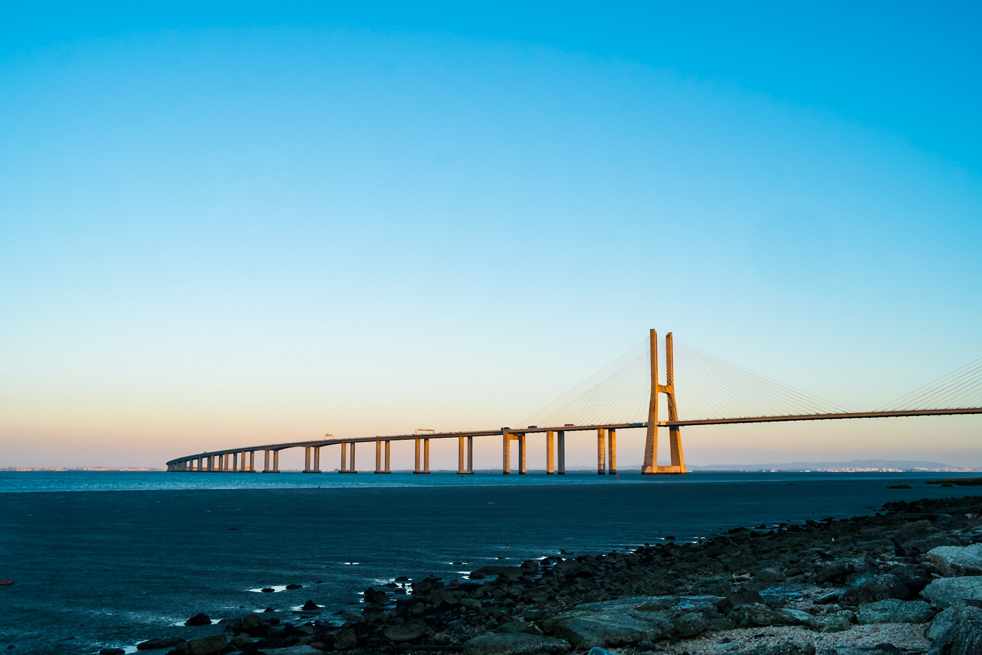 Vasco da Gama's Bridge during a sunset with clear sky