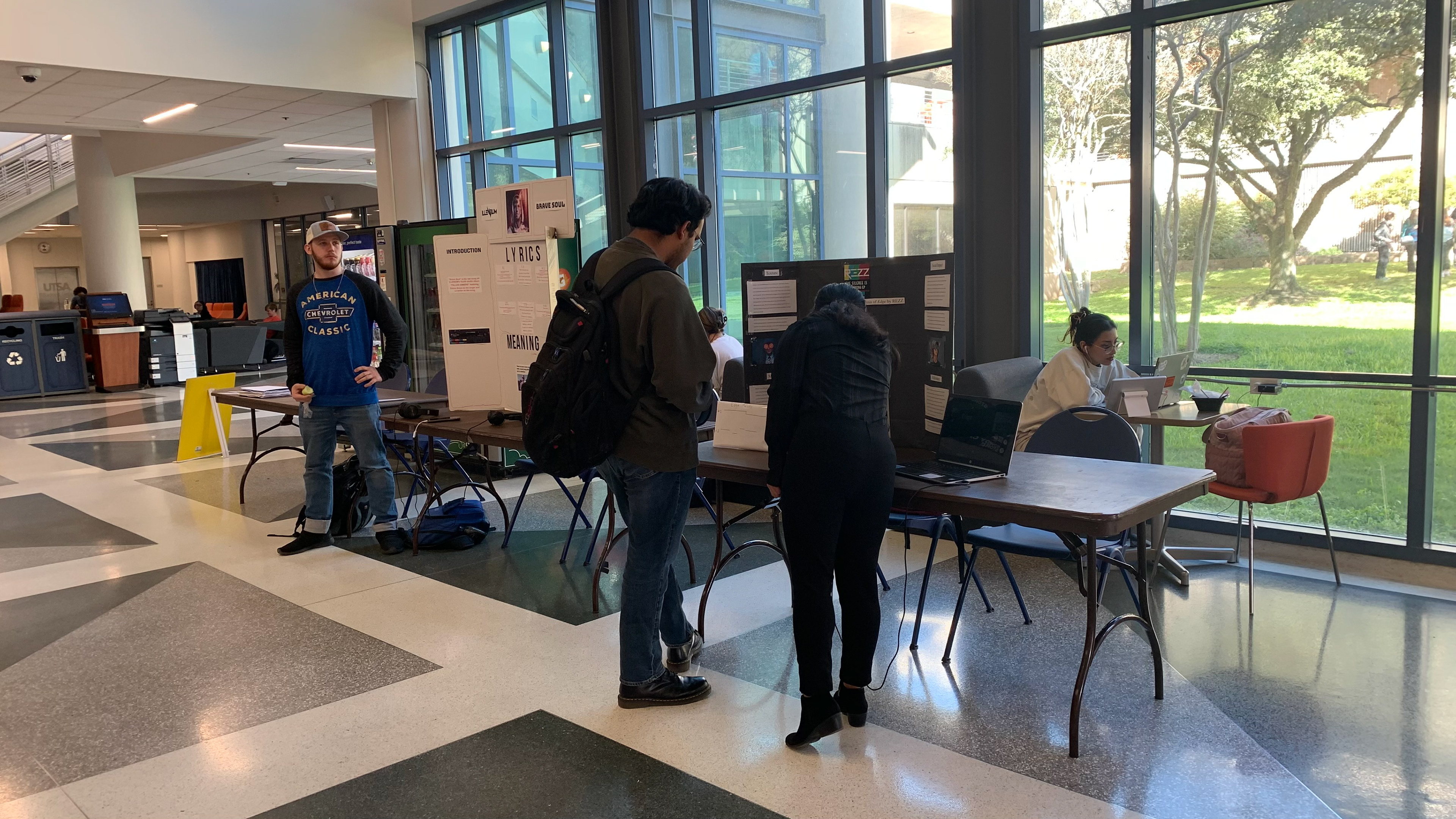 Wide shot of two presentation poster stations during one of the quieter moments of the Poster Presentation Expo.