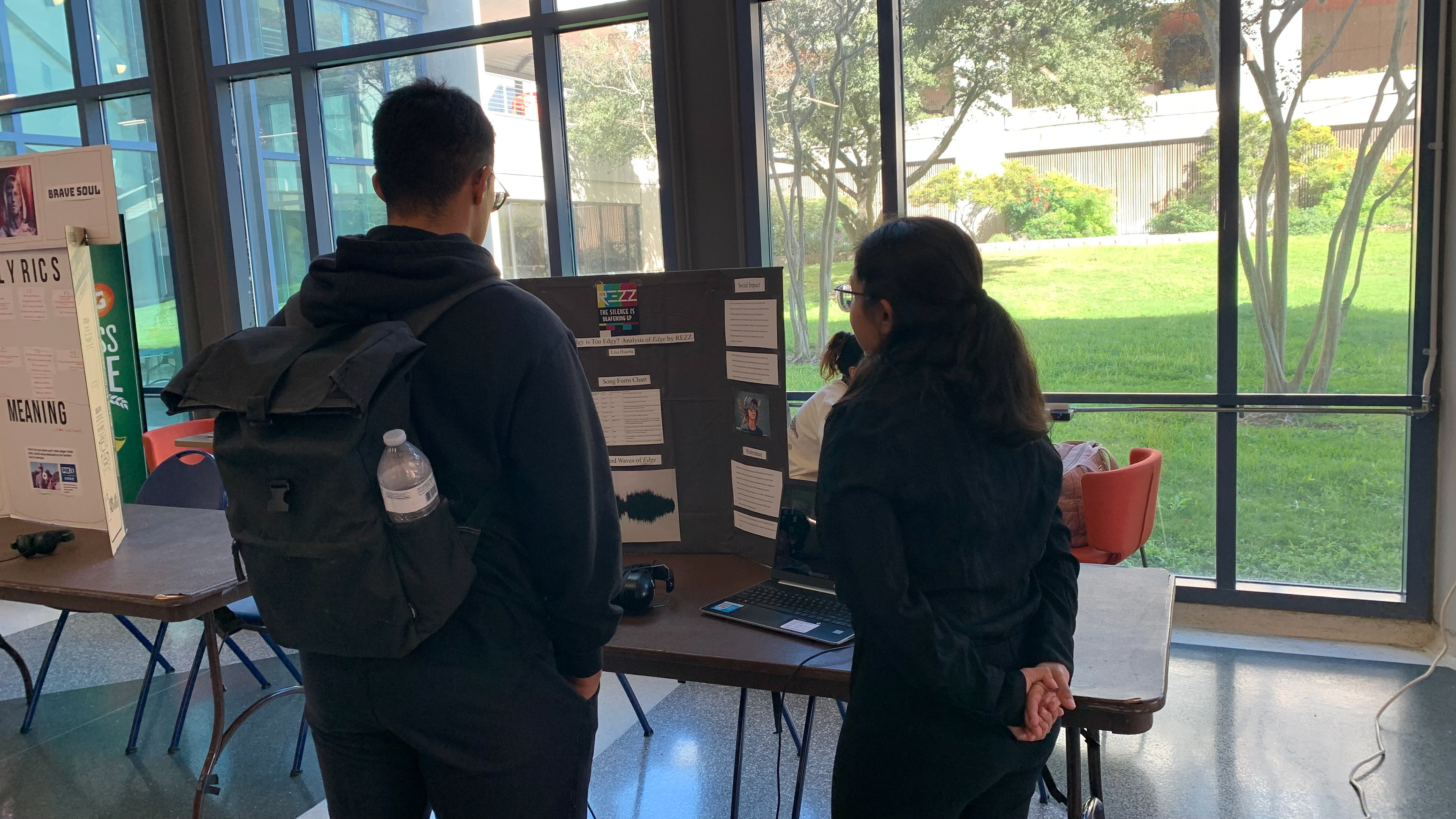 Lisa Huerta presents on "Edge" by REZZ to an audience member.