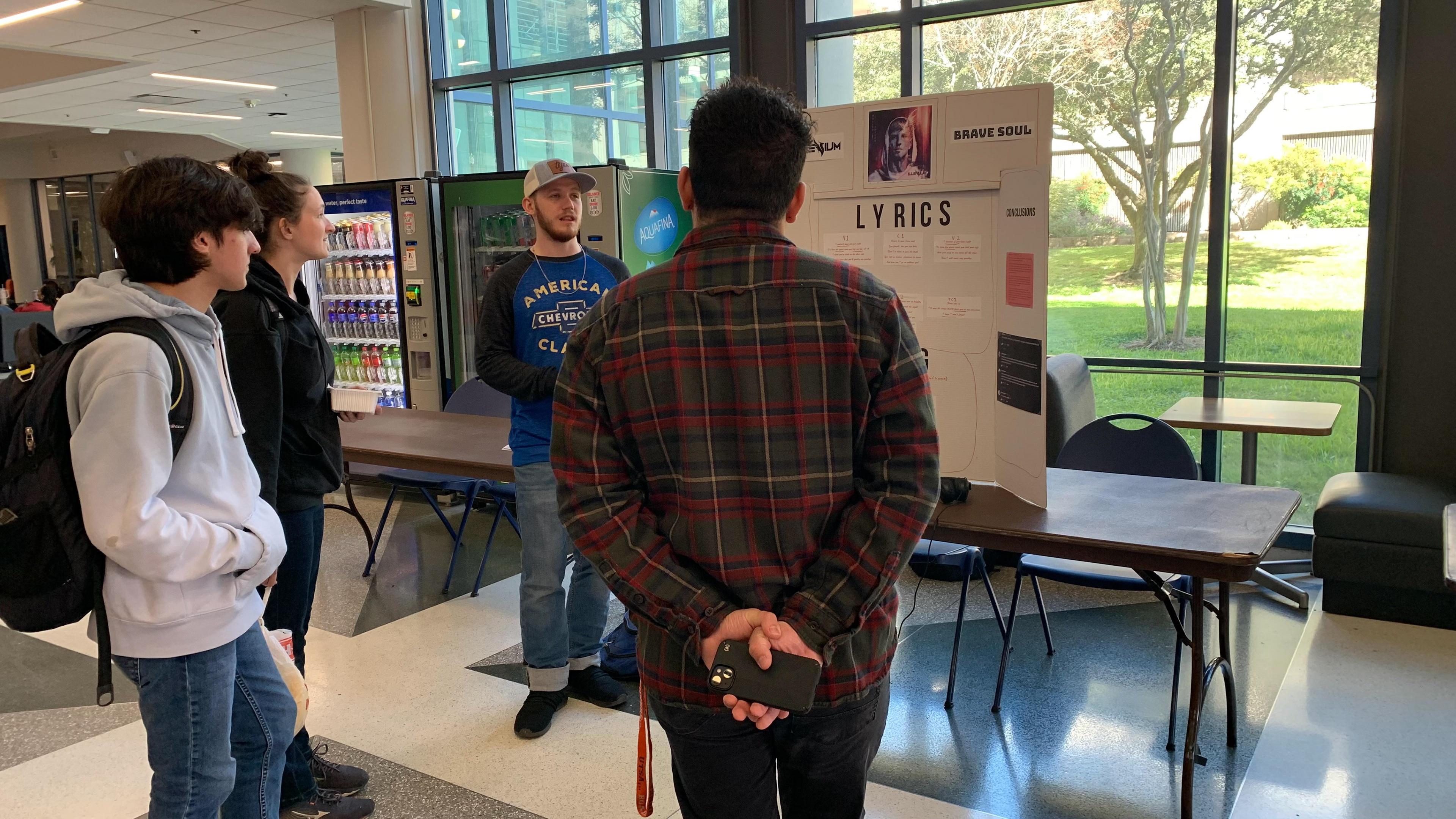 Daniel Walker presents on "Brave Soul" by Illenium to audience members.