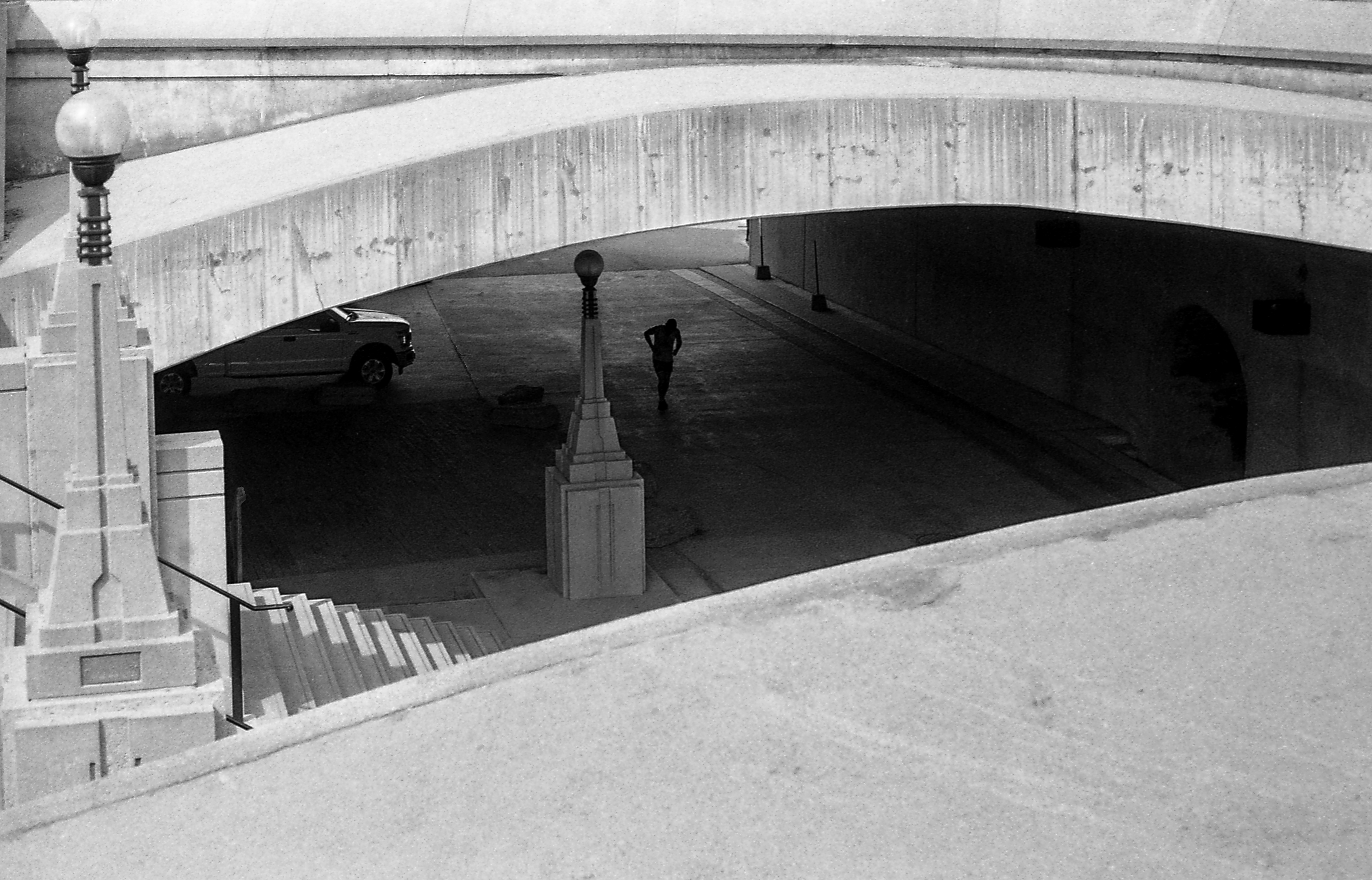 Under the Bridge Ottawa - 135 film "You could hear the echoes of his feet hitting the pavement softly with each kick of the sack." Beautiful lines, form & story.