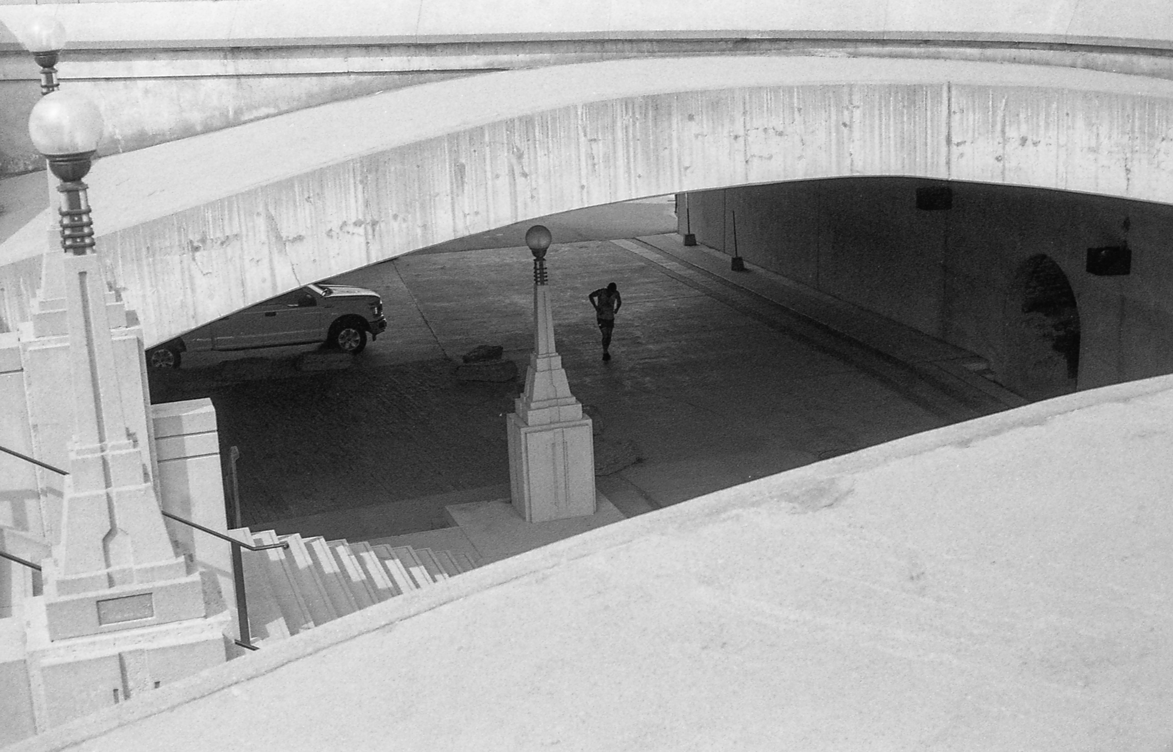Under the Bridge Ottawa - 135 film "You could hear the echoes of his feet hitting the pavement softly with each kick of the sack." Beautiful lines, form & story.