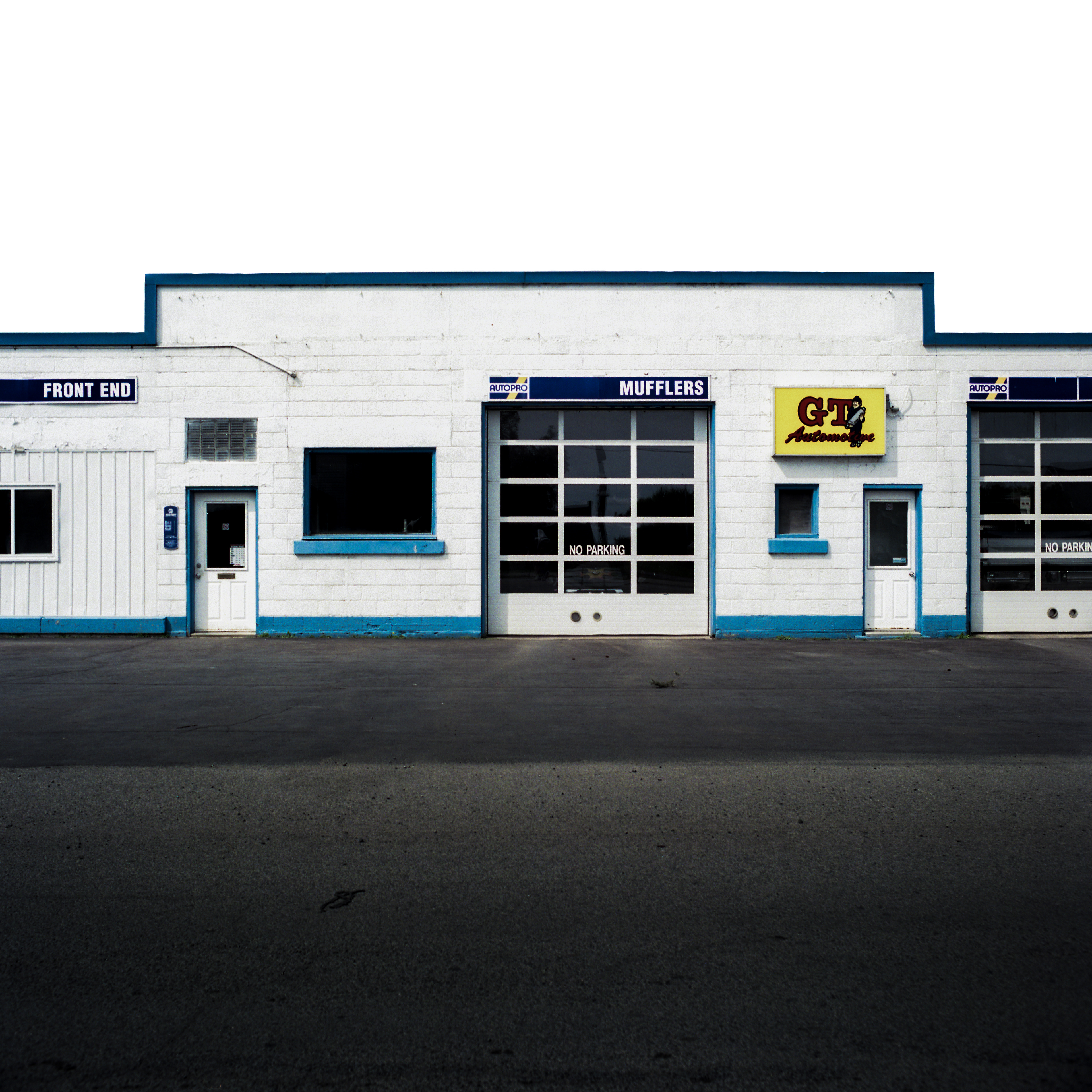 Muffler No. 1 - 120 film Sitting alone quietly lost in time. I love the symmetry & timelessness of this print. The blues are some of my favorites.