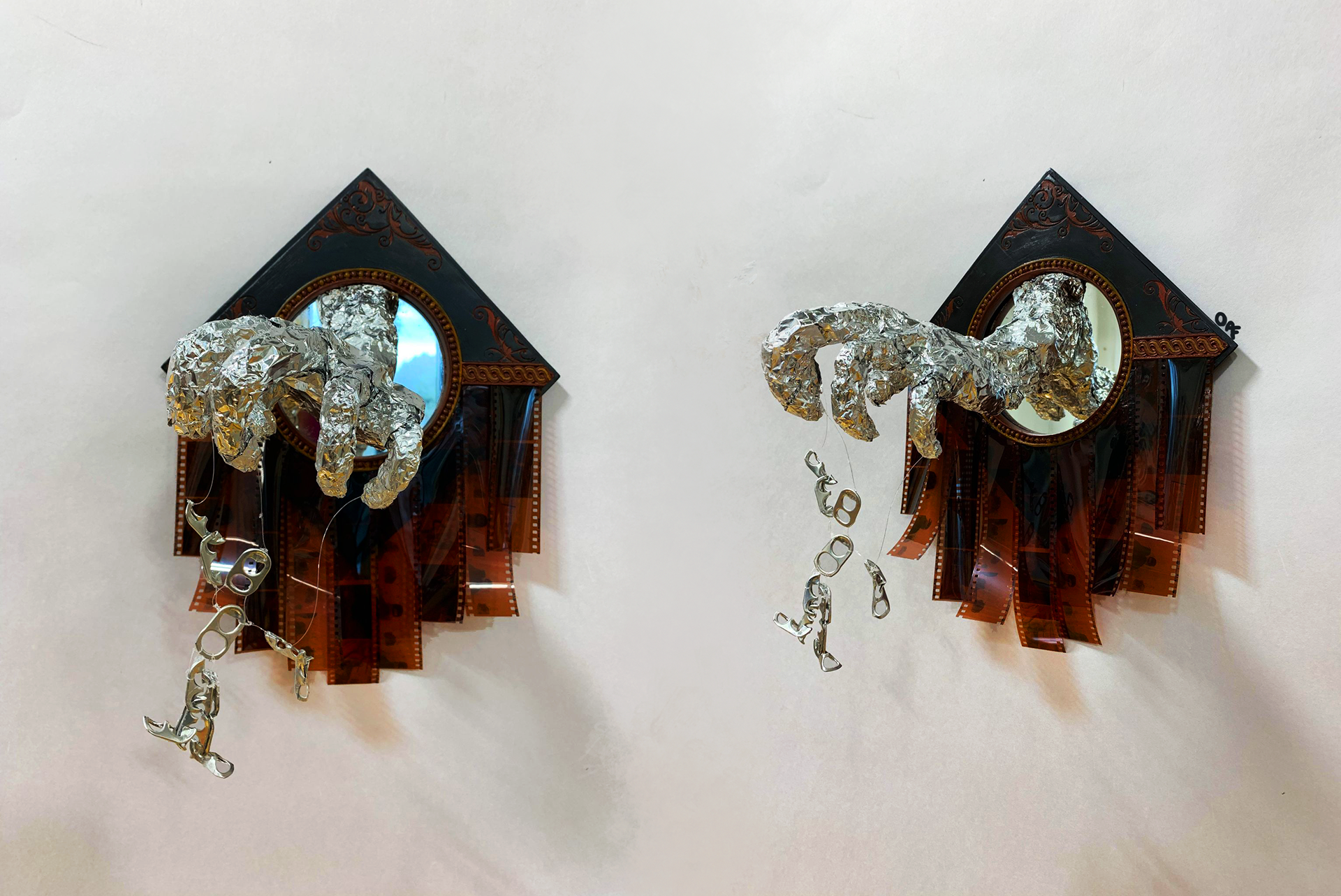 The Puppeteer ; pop tabs, tinfoil, wire, old film strips, framed mirror, acrylic paint, hot glue (2020)