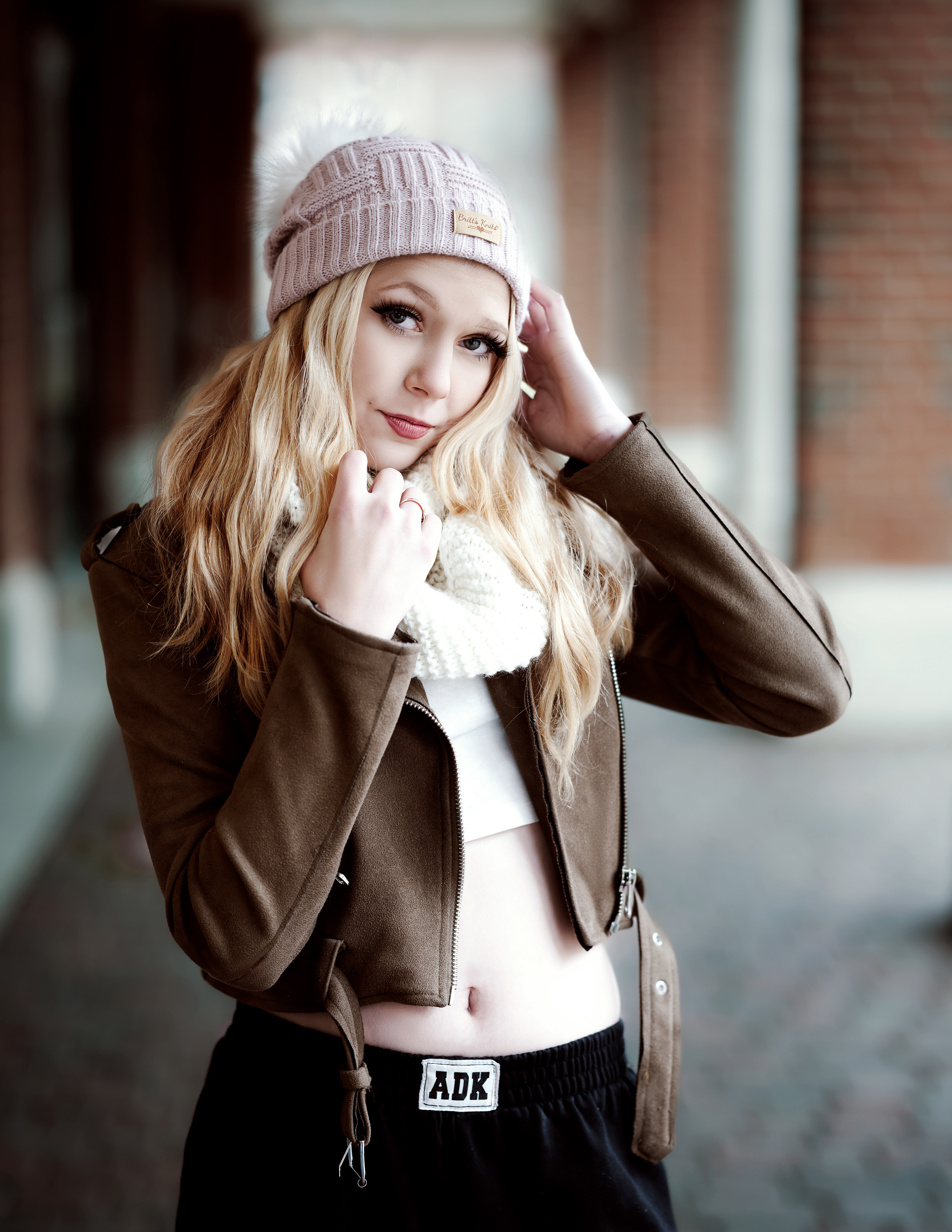 A winter portrait photo of Amanda in an urban setting 