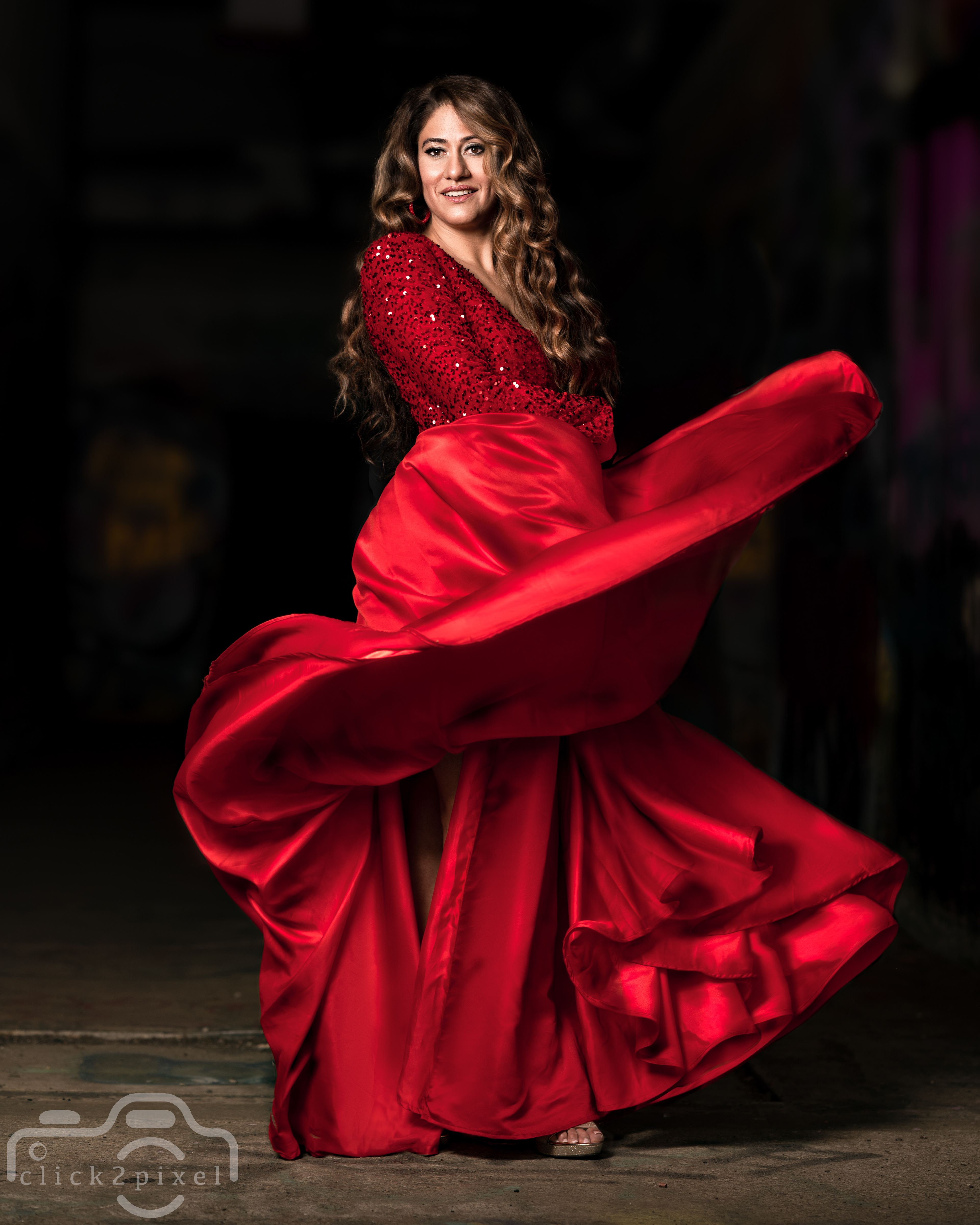 A portrait image of Sonya in a red dress