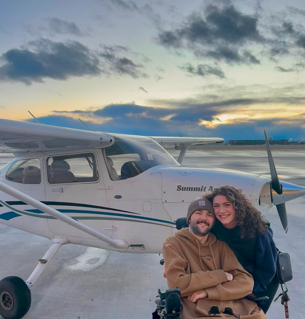 George and his girlfriend, Halle, pictured in front of a small hopper plane that they flew around Gallatin County in. George's friend, Logan, is a pilot and flew the plane for them. 