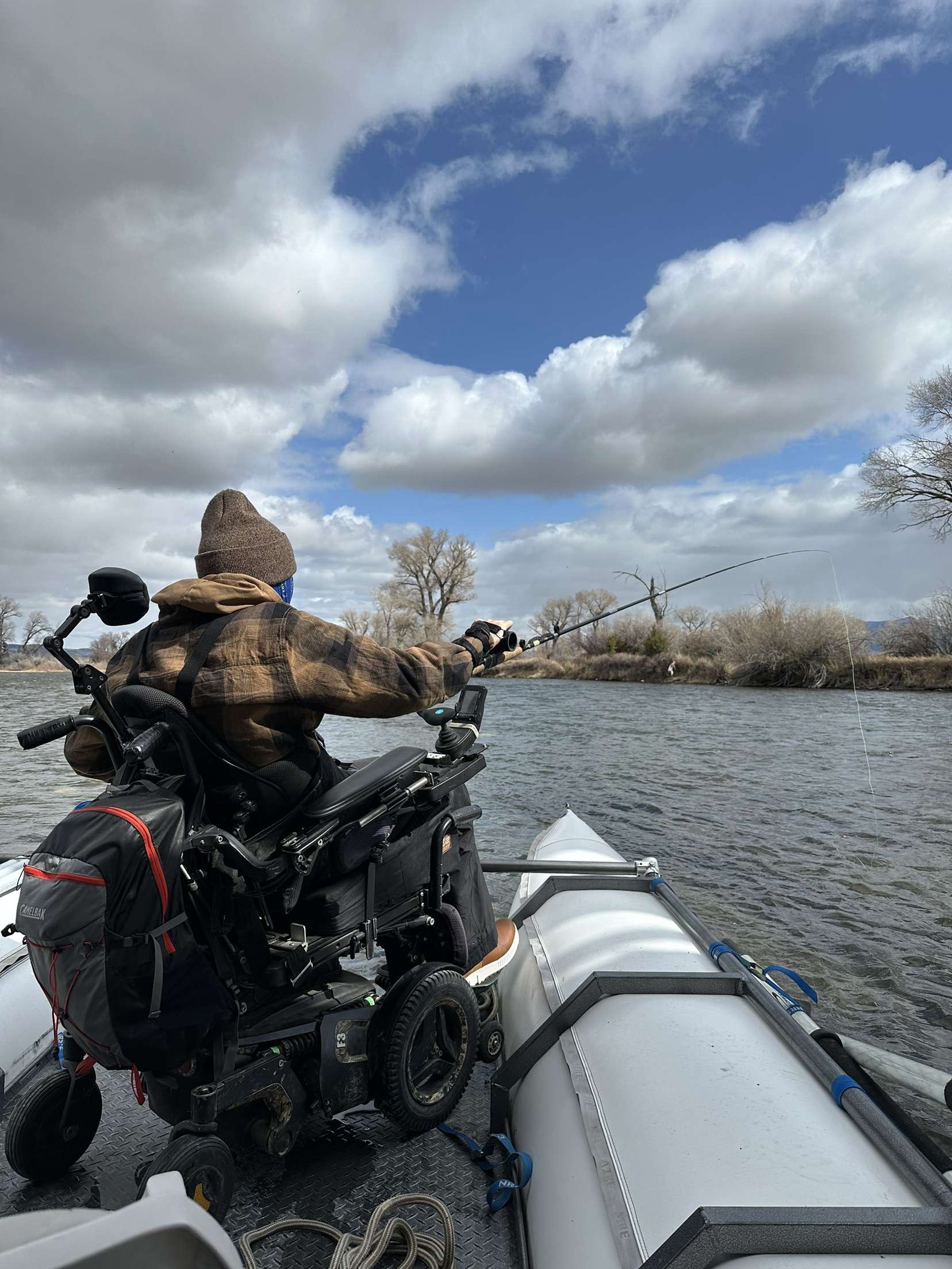 George fishing off an accessible raft made at Camp Bullwheel. George was in a commercial for this nonprofit organization. 