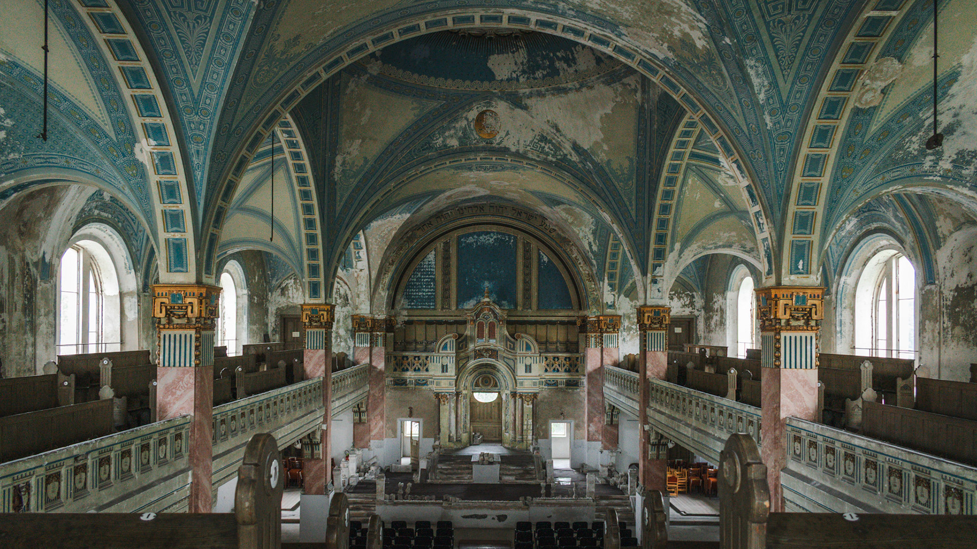 Ornate painted church ceiling with religious murals