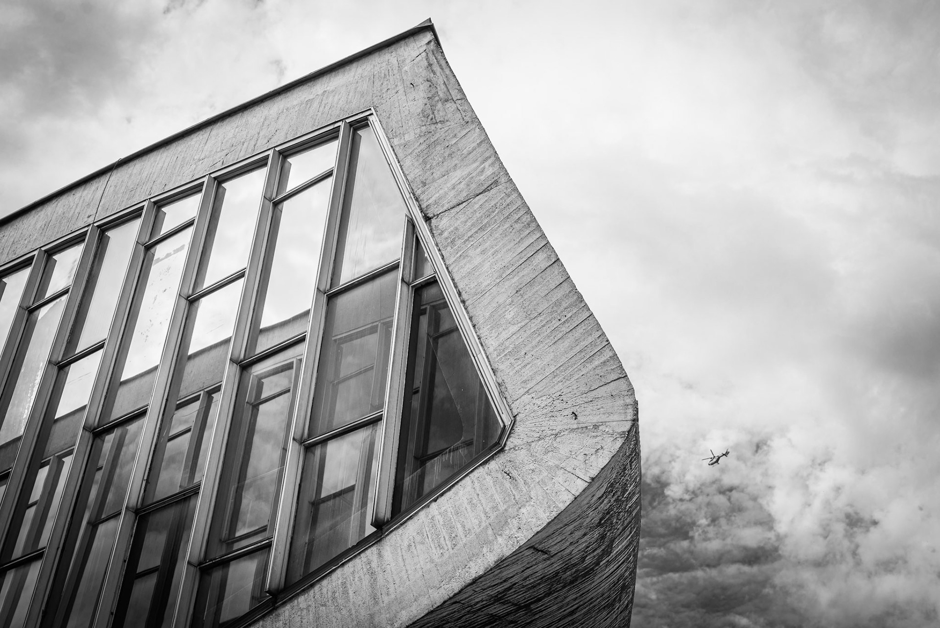 Modern glass office building exterior in urban setting