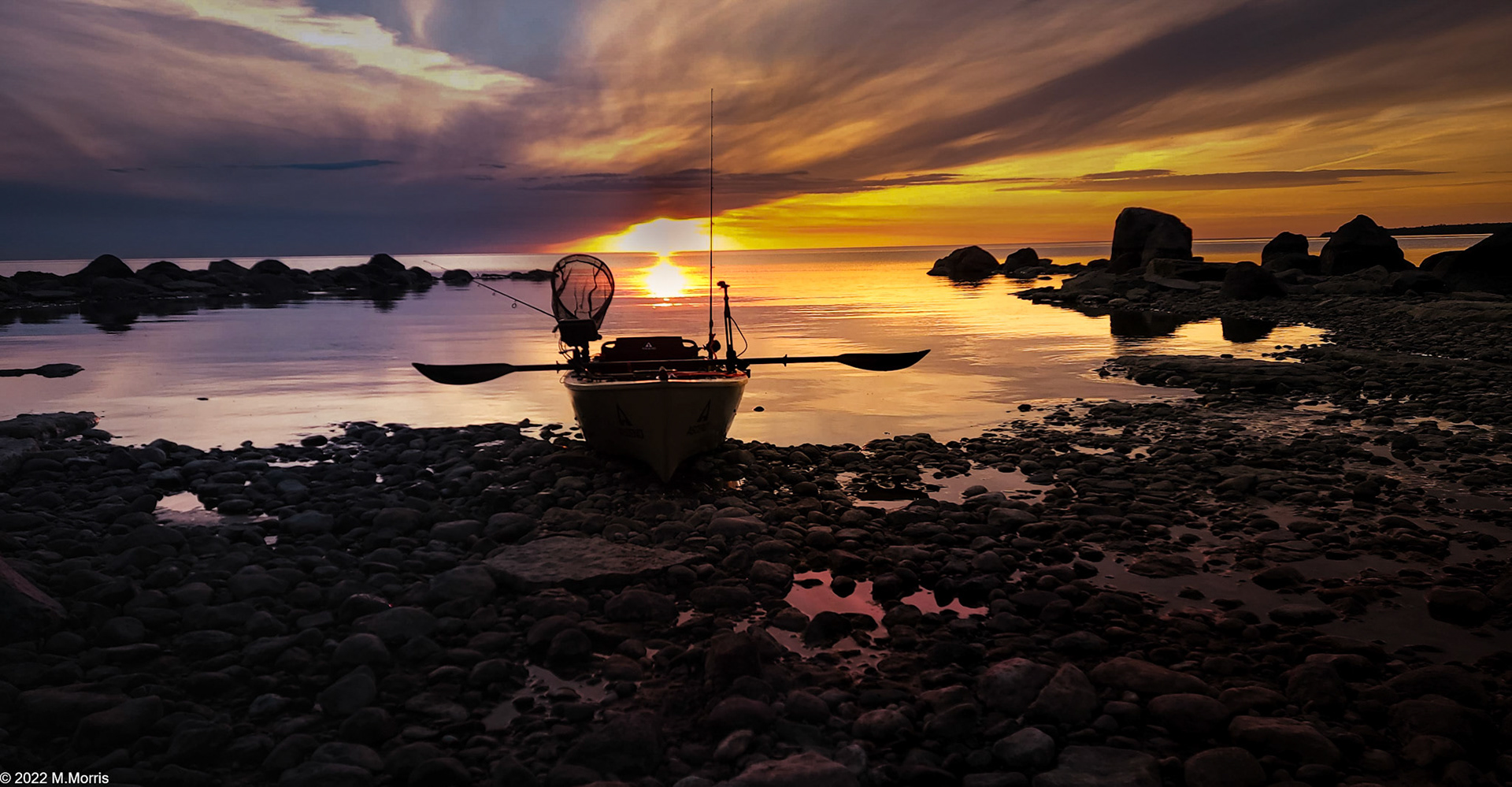 Kayak Beached At Sunset