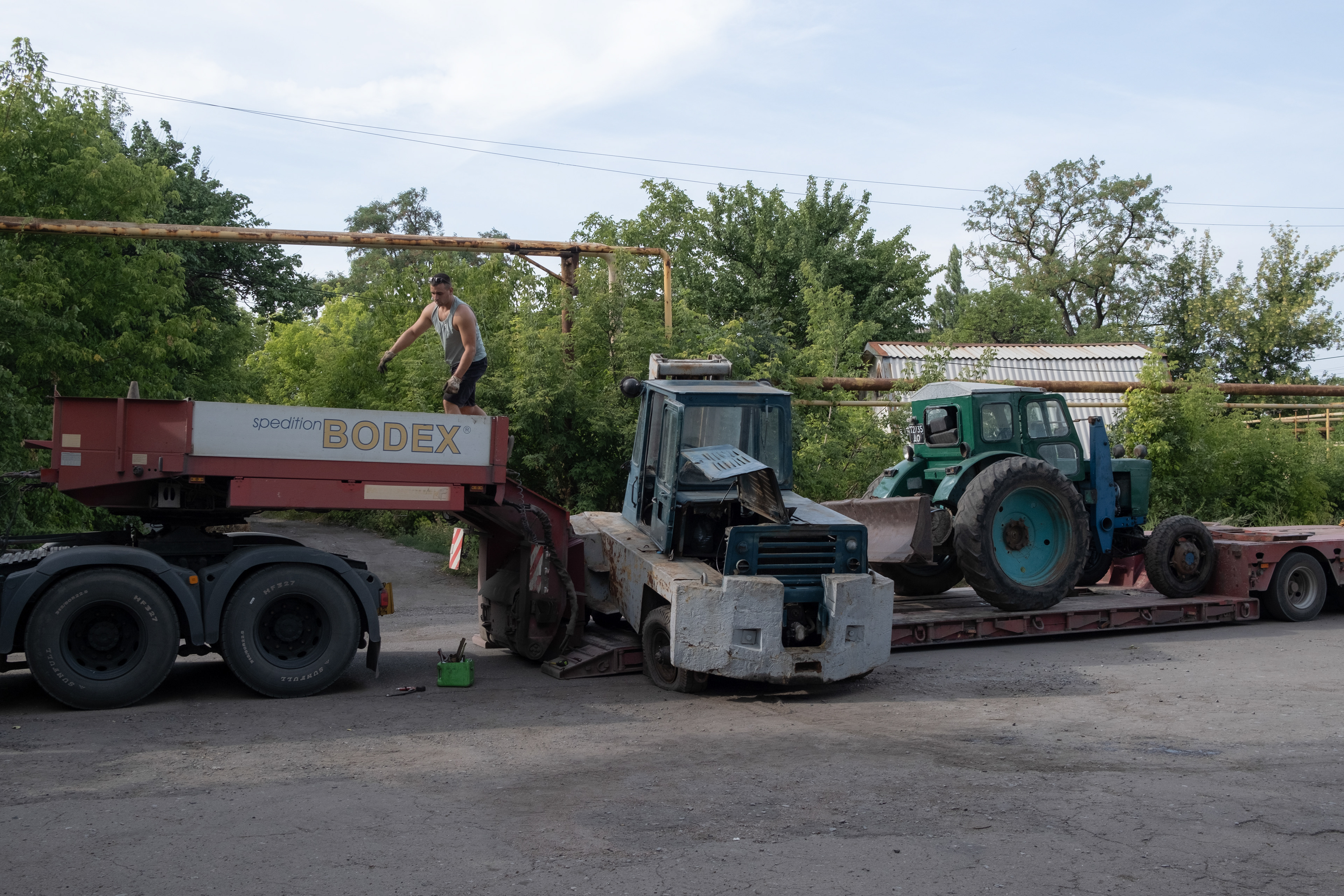 A small agricultural firm evacuating its machines