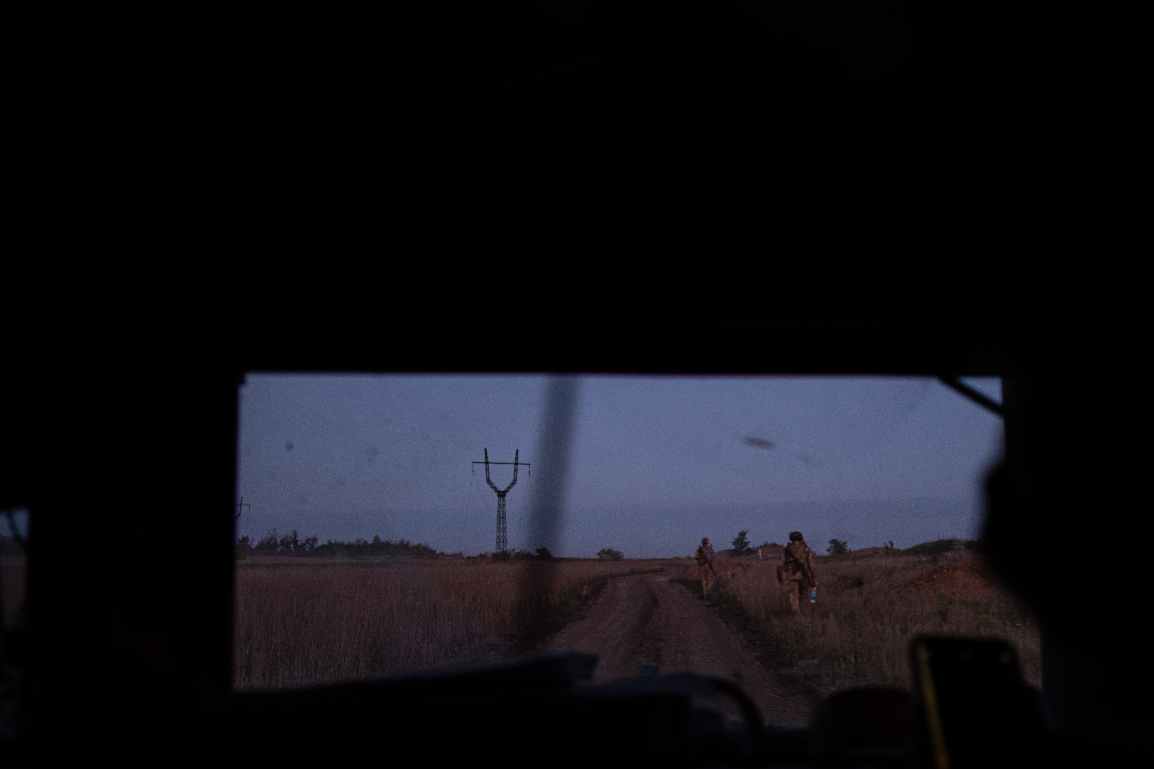 Ukrainian infantry soldiers walking from their positions at 3 am in the morning.