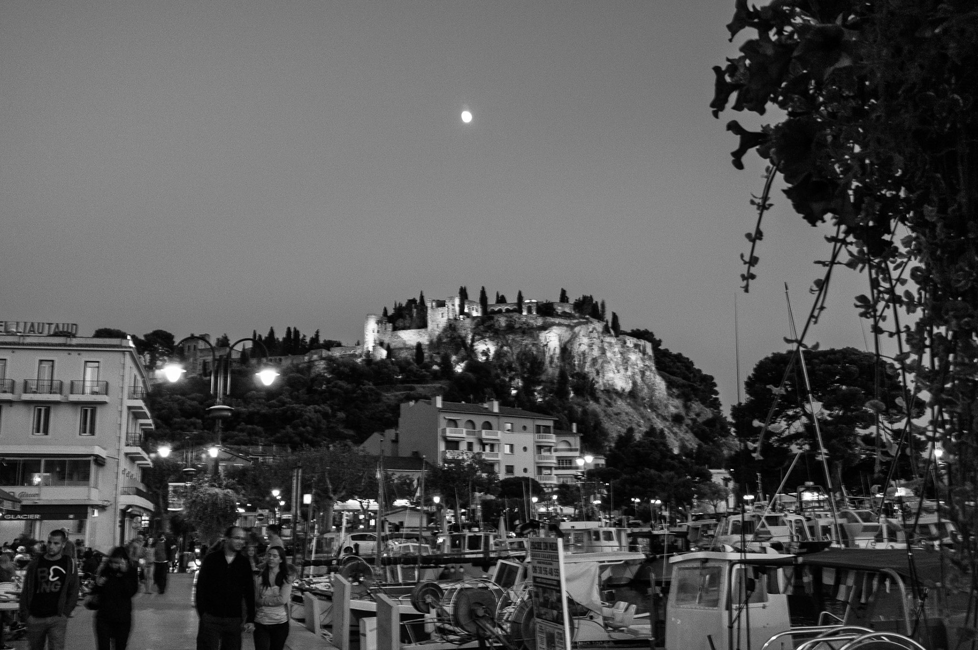 France, Cassis: Castle on hilltop at dusk