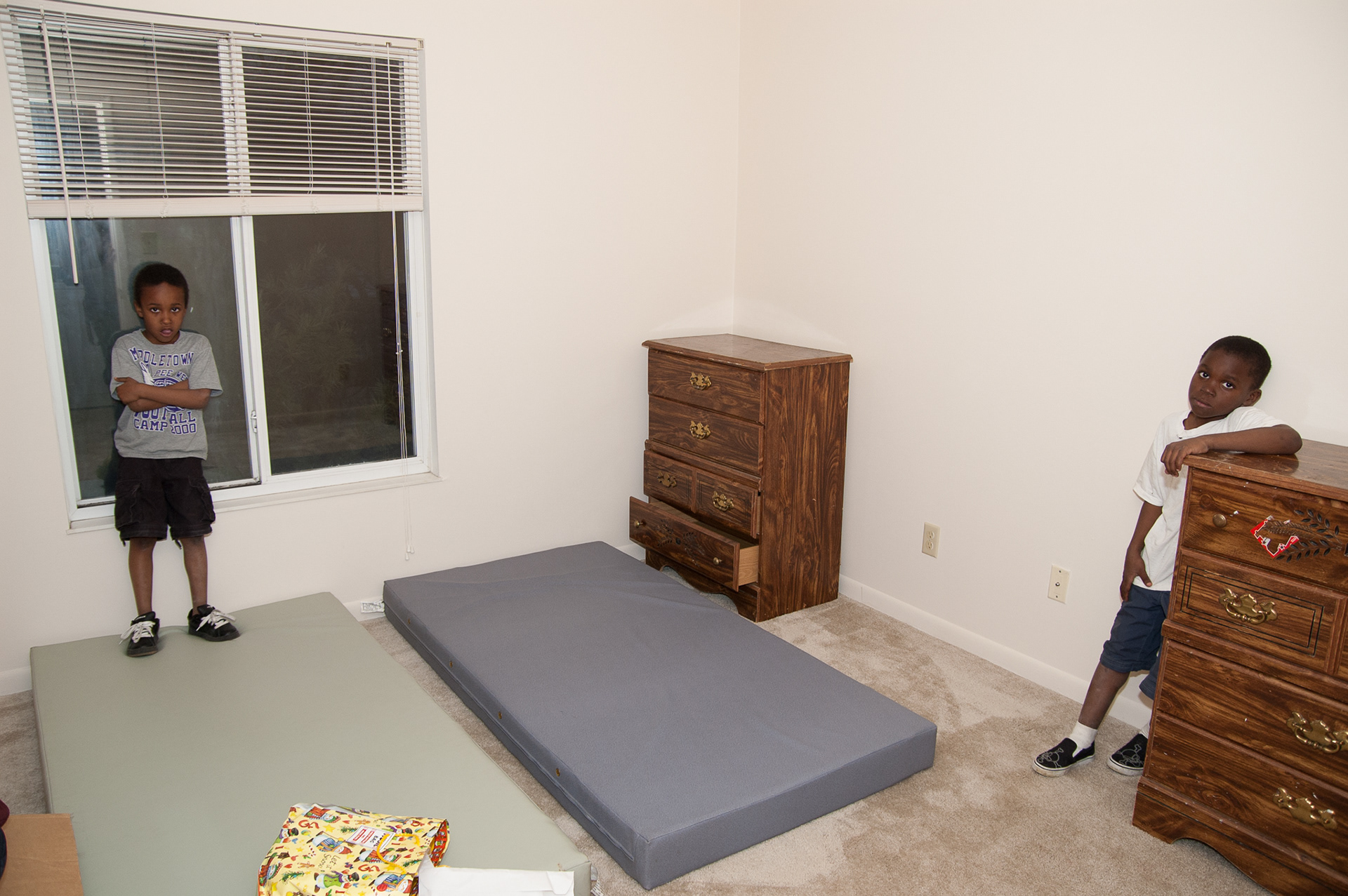 Cameron and D’Juan in their new bedroom. IHNWC provided mattresses and dressers for their room.