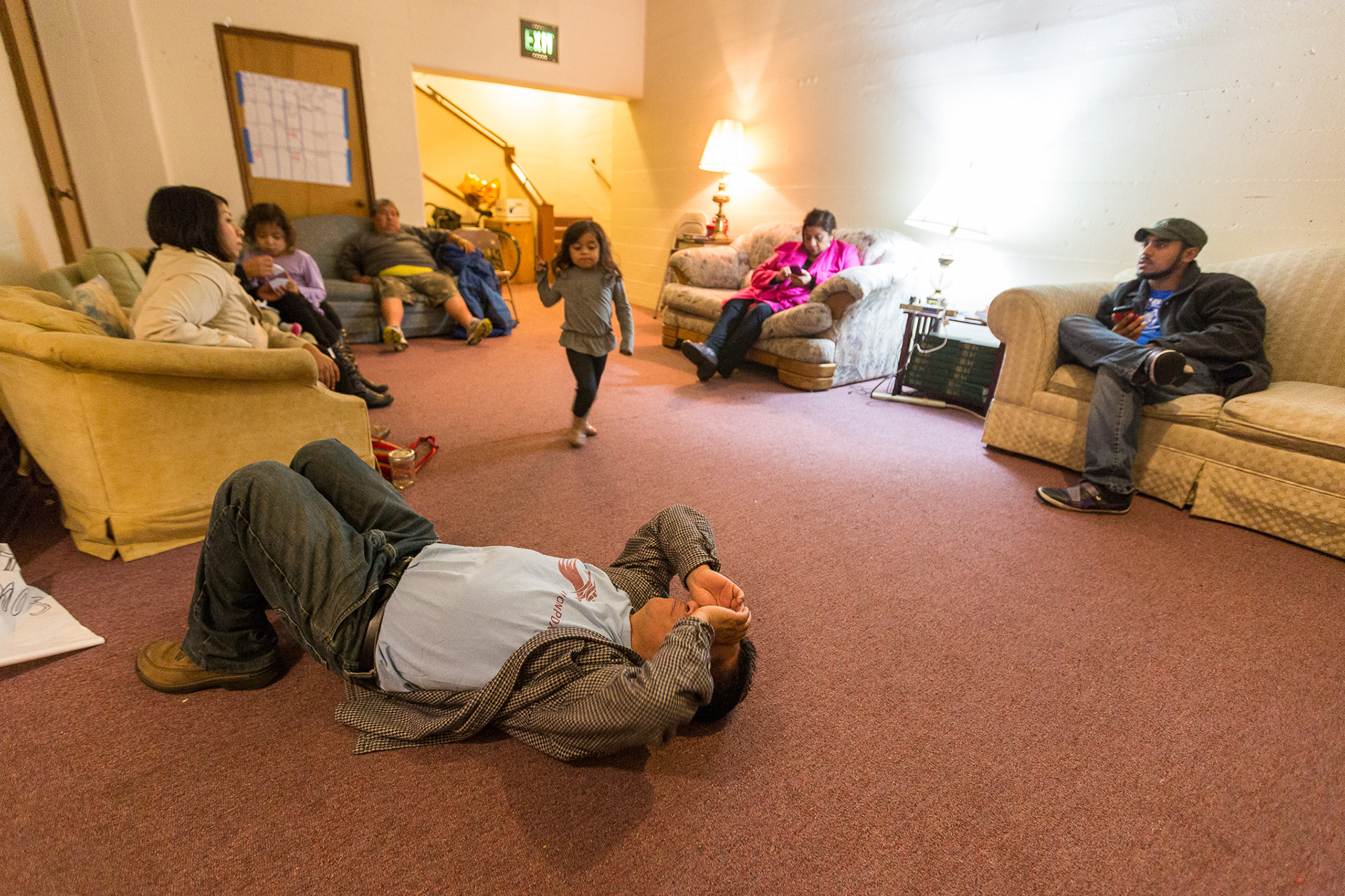Portland Sanctuary seeker, Francisco Aguirre, and his wife Dora are surrounded by friends outside Aguirre's makeshift apartment in the basement of Augustana Lutheran Church following a support rally at the US Customs and Immigration Services office.