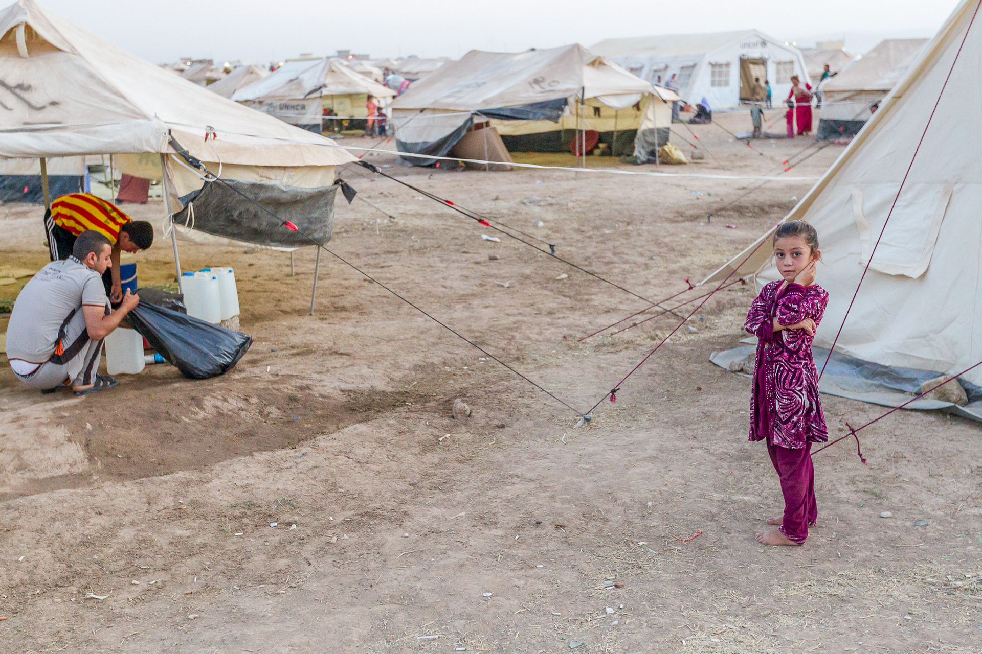 A young girl near her family's tent in the large internally displaced persons (IDP) camp, primarily Yazidi, in Khanke, Iraq. The town's population has swelled from 25,000 to 100,000 as ISIS forces drive religious minorities from Mosul and the area of the Ninevah plain.