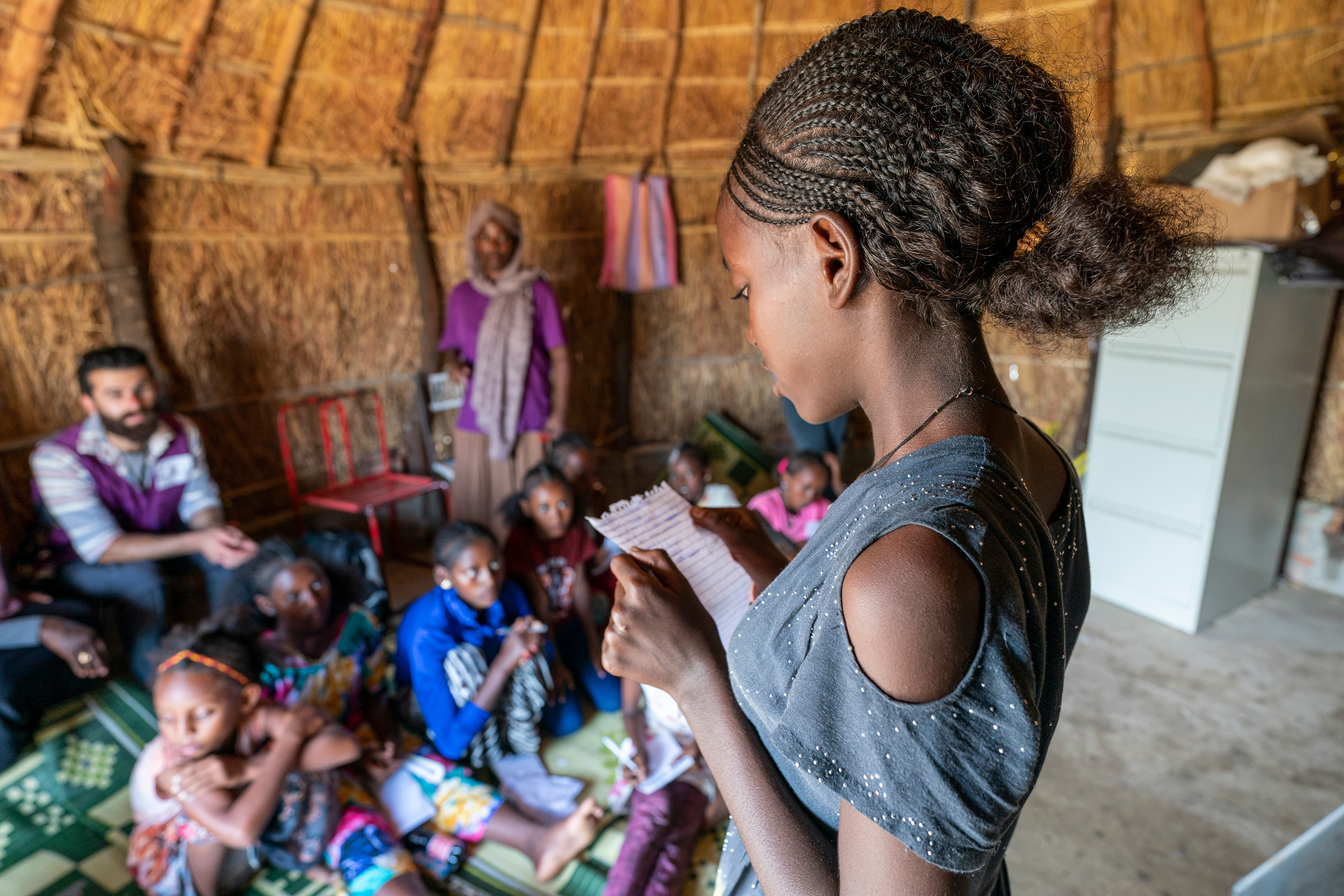 A student reads a short essay in an English class taught by Bsrat Welensea for Tigrayan girls at a Norwegian Church Aid sponsored center for women and girls in the Tuneidba Refugee Camp near Gedaref, Sudan