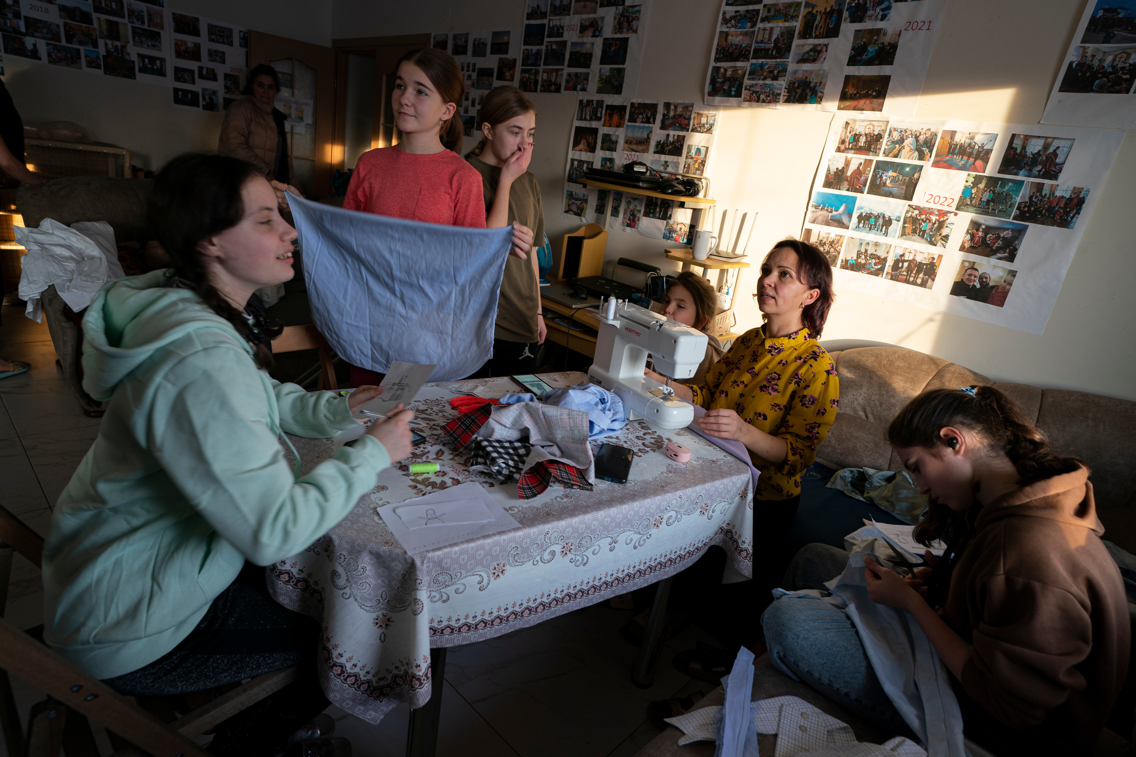 Oksana Zavadskyi teaches teen girls how to sew aprons at the home she and her husband, Volodymyr, run near Mukachevo, Ukraine.