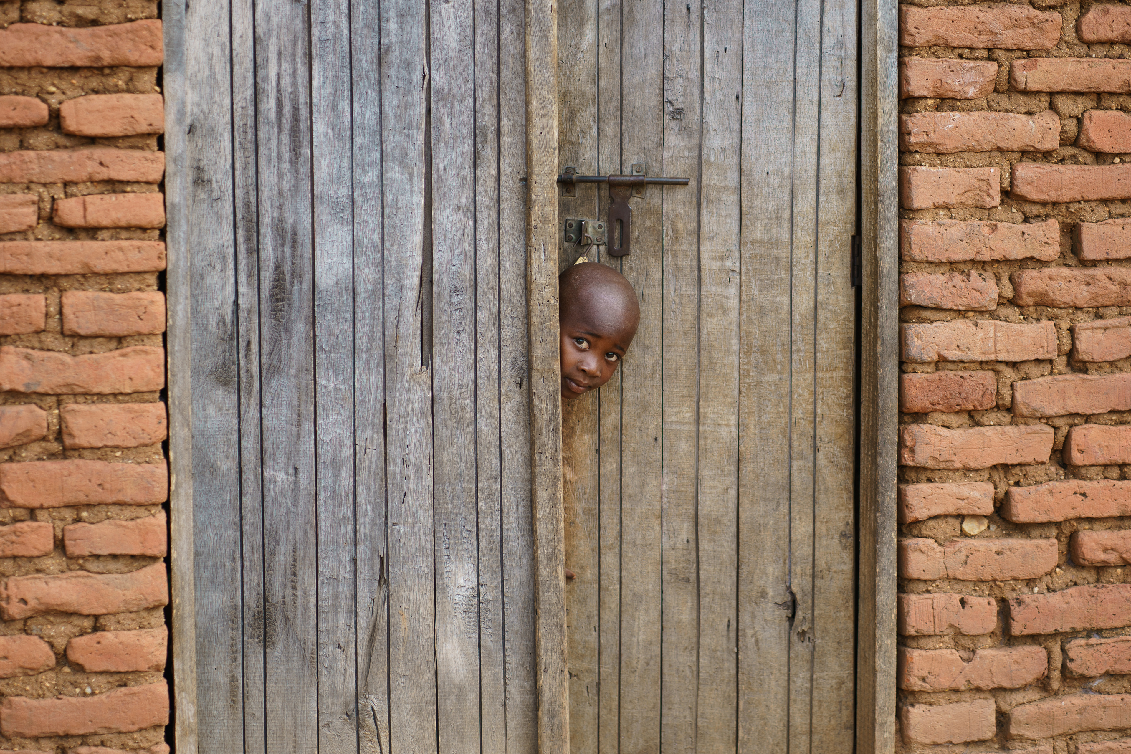 A boy observes visitors near the village of Romero, Tanzania. 
