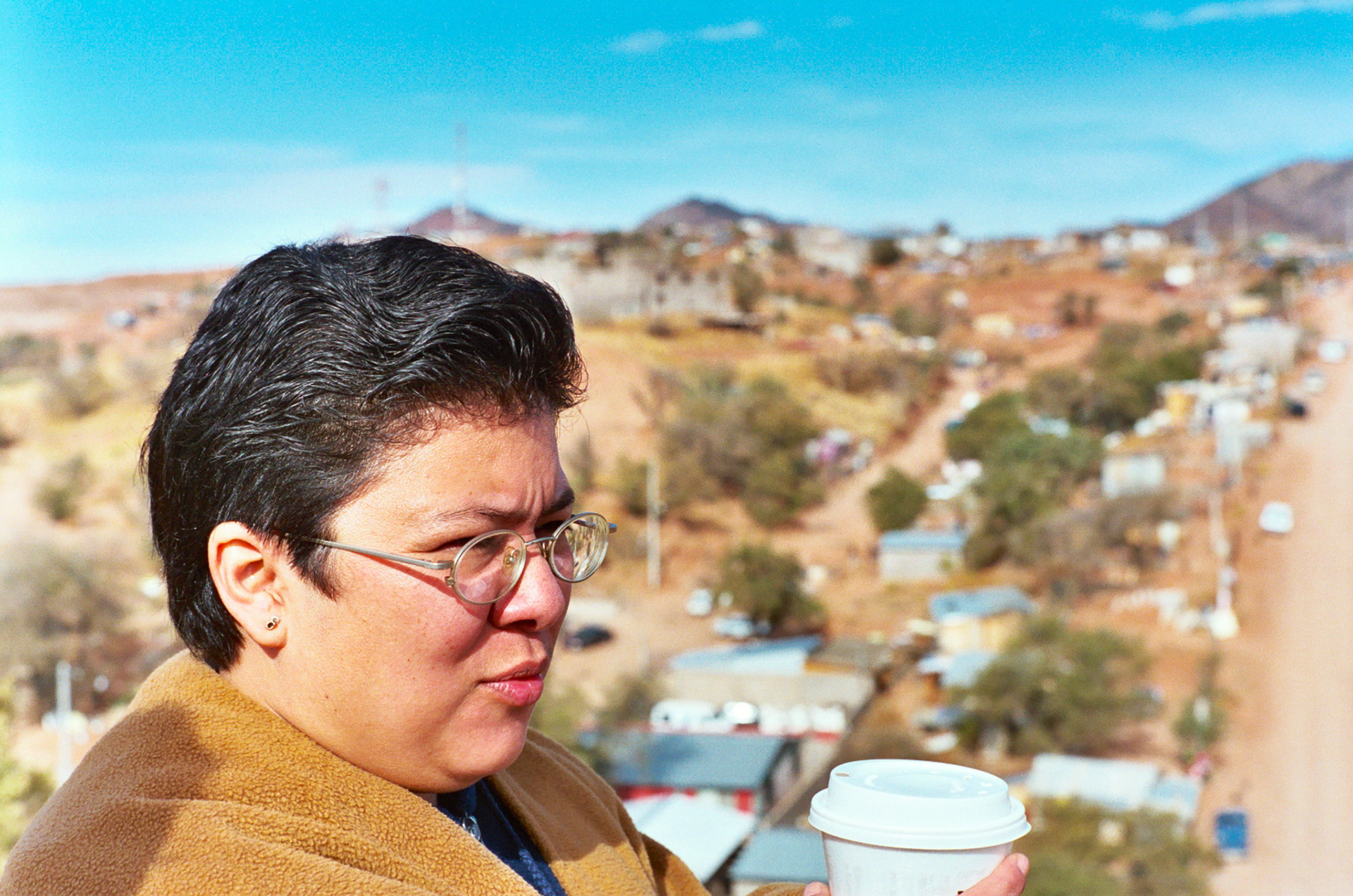 Noemi Peregrino-Gonzalez, a Mexican nun, accompanies our group and gives cultural insight into the problems of economics, poverty and migration as she overlooks an invasion community of migrant laborers in Nogales, Mexico.