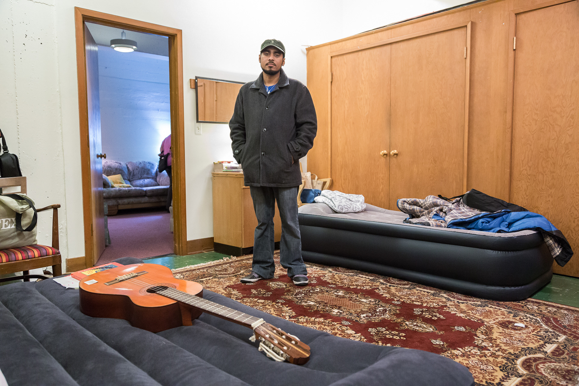 Portland Sanctuary seeker, Francisco Aguirre, in the storage room Augustana Lutheran Church has converted into an apartment. Francisco's wife and daughters stay here with him on the weekends.