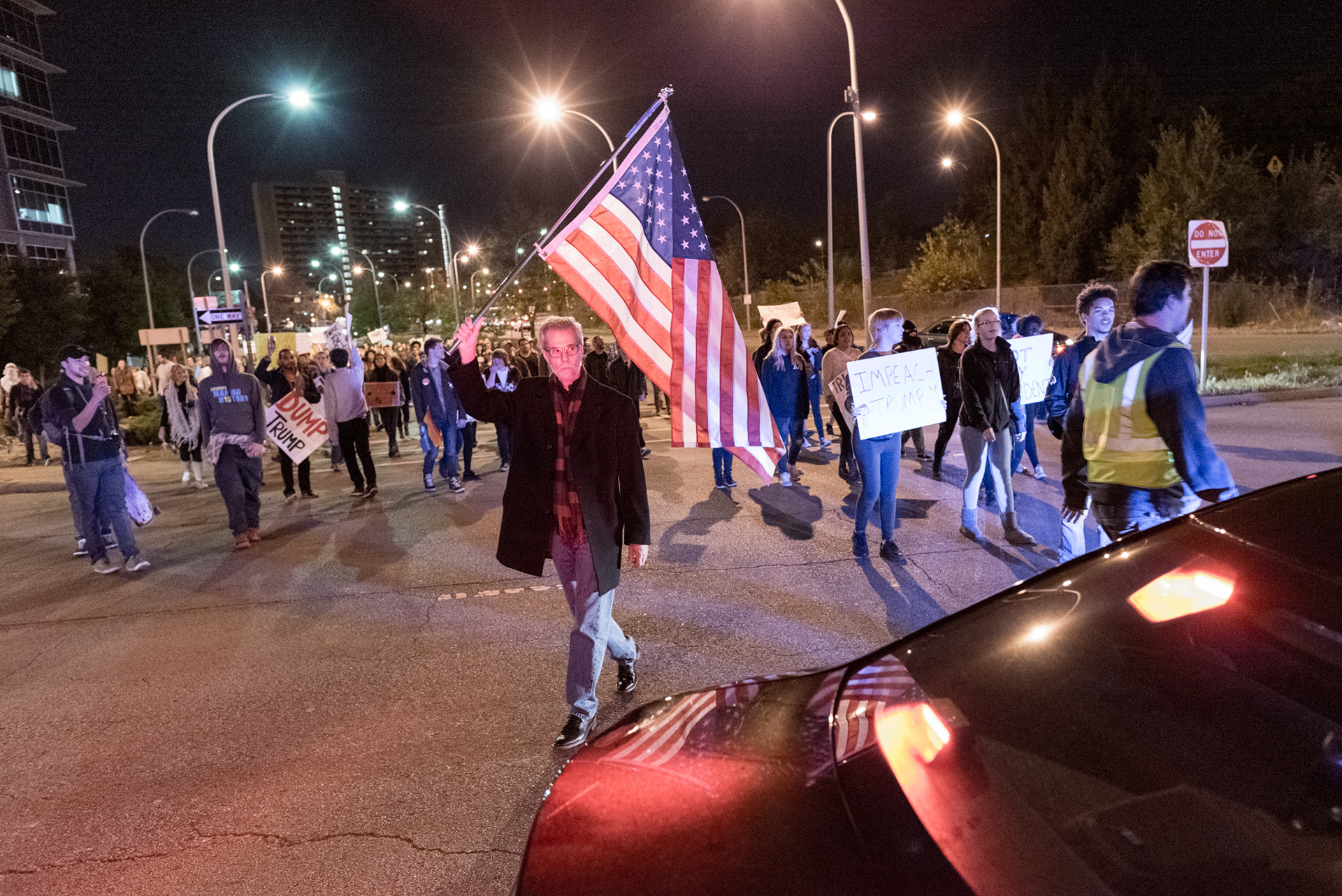 A police barricade prevents marchers from accessing I-65 in Louisville, Kentucky as approximately 1,000 protesters rallied November 10, 2016 to register their concern about harmful rhetoric used by president-elect Trump.