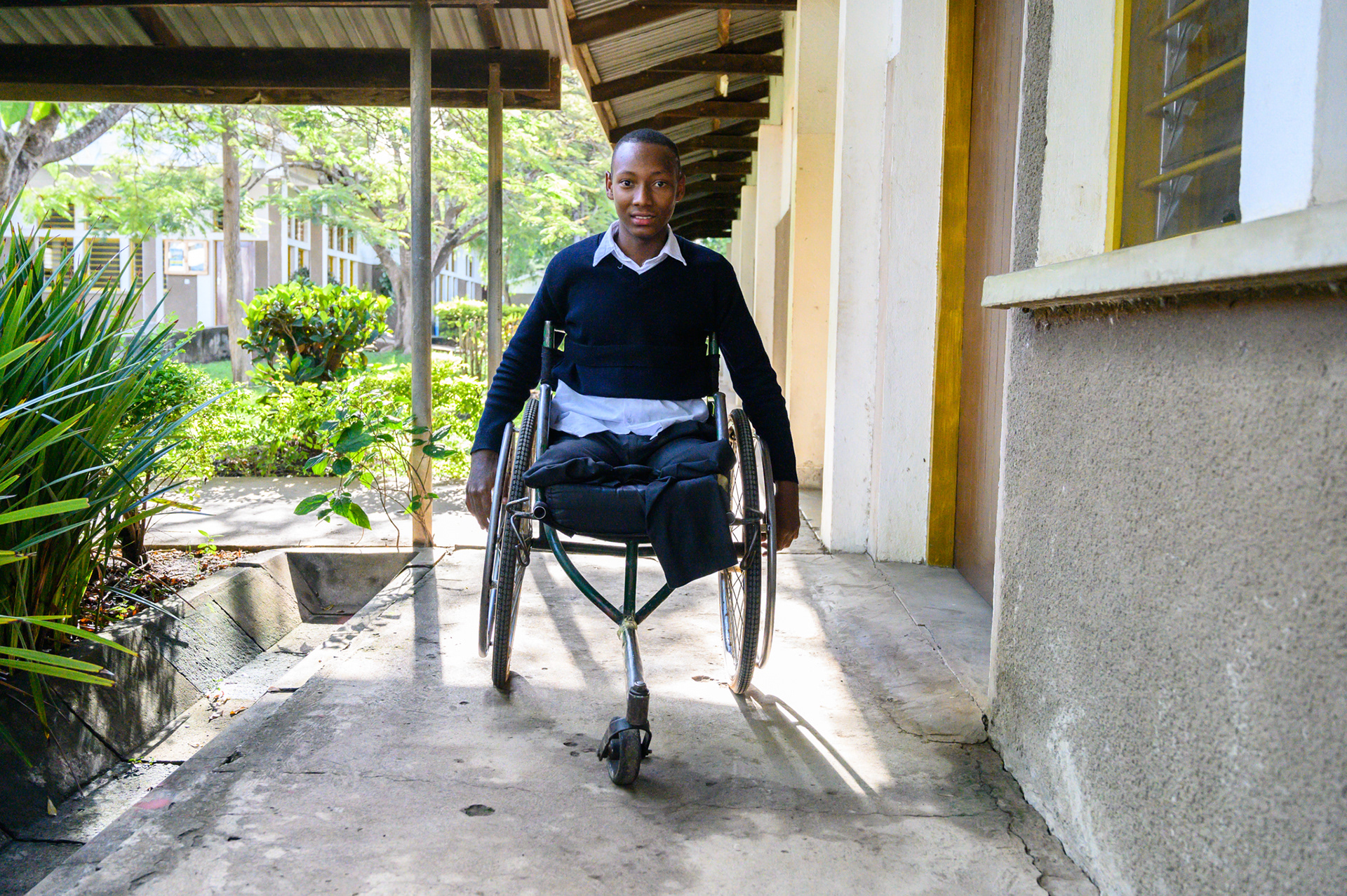 Michael Simon pauses to chat with the photographer at the Usa River Rehabilitation & Vocational Training Center in Tanzania.