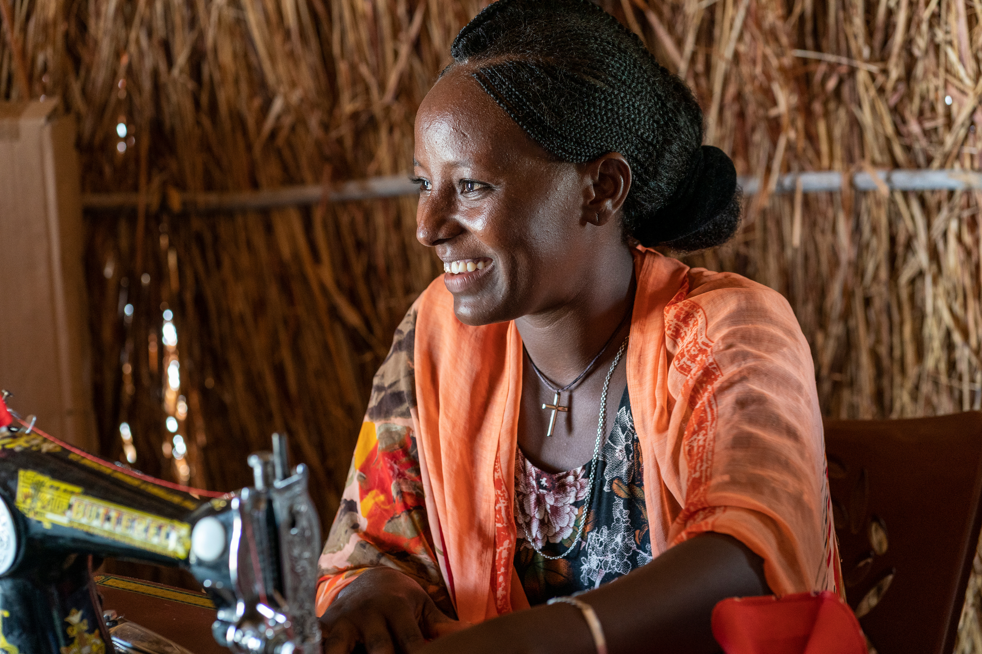 Tigrayan refugee Yemar Abraha practices sewing at a tailor training program sponsored by Norwegian Church Aid (NCA) in the Tuneidba Refugee Camp near Gedaref, Sudan. 