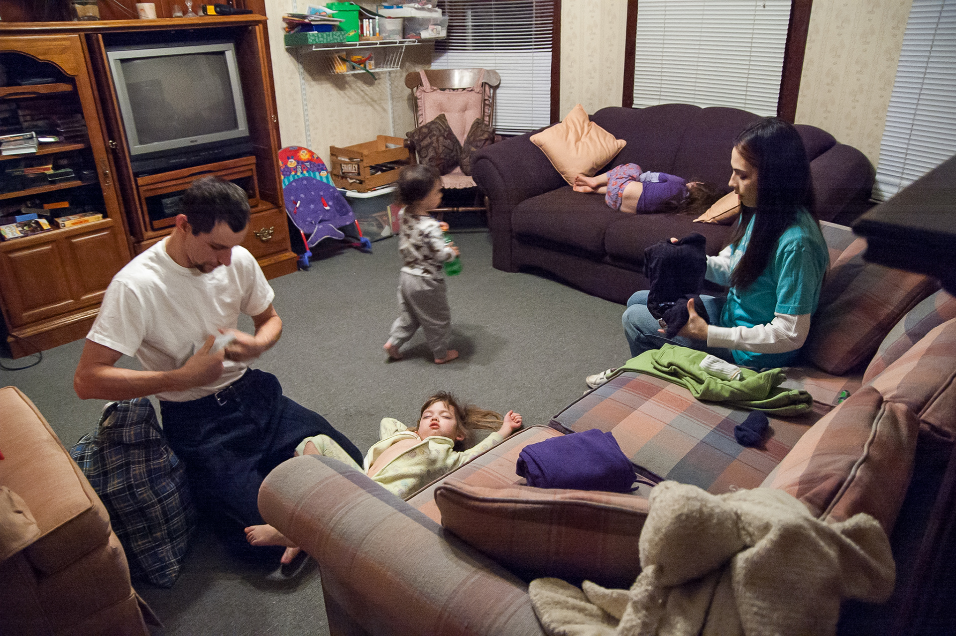 Don Reynolds and Amanda Pottorf wake up at 5:45am to get their three children ready for the day. Provided transportation takes Don to work at 6:45am and Amanda and the children to daycare and school at 7:30. This week their entire family sleeps in the living room of the IHNWC Day Center.