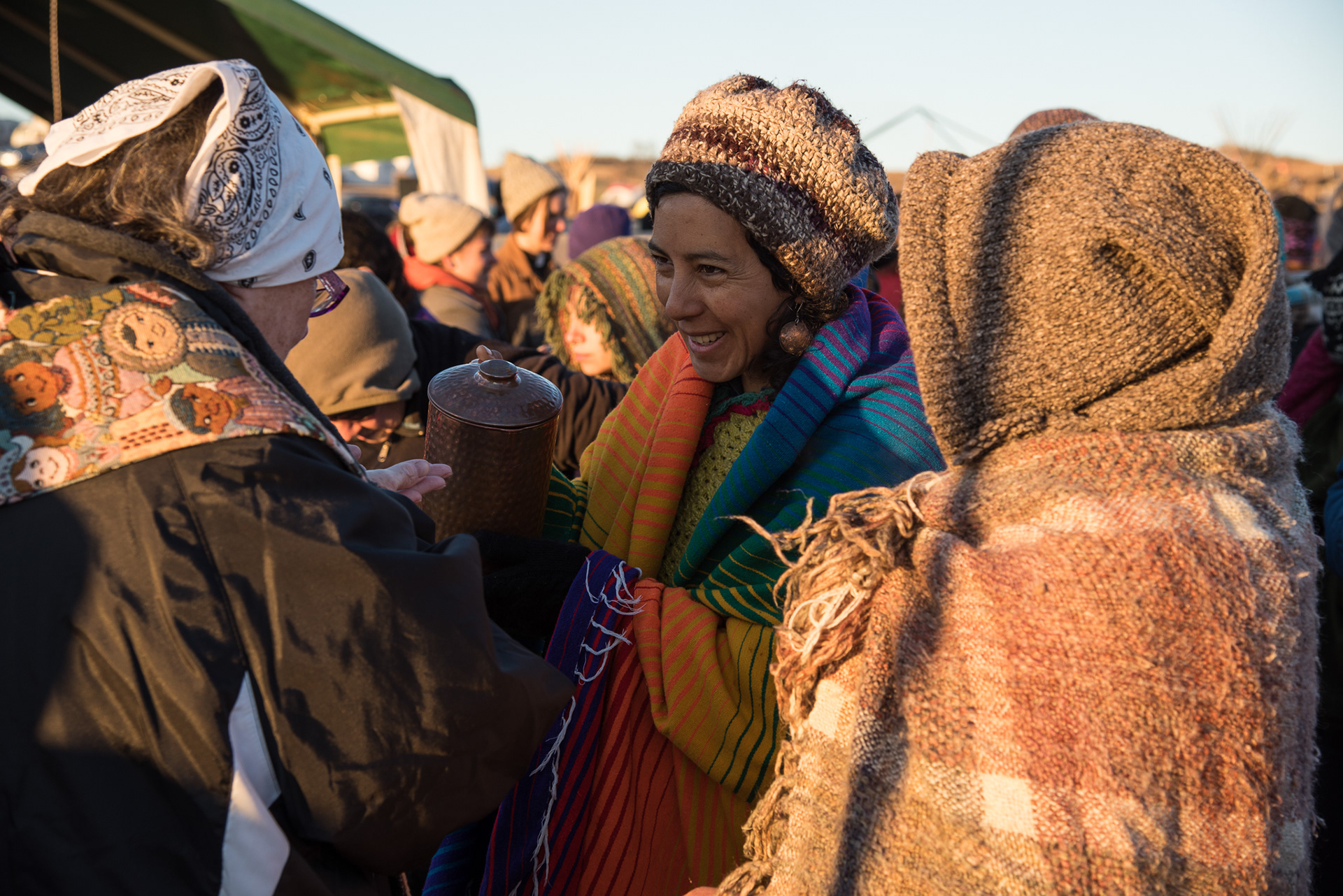 Clergy are met at the prayer circle with cleansing water and a smile.