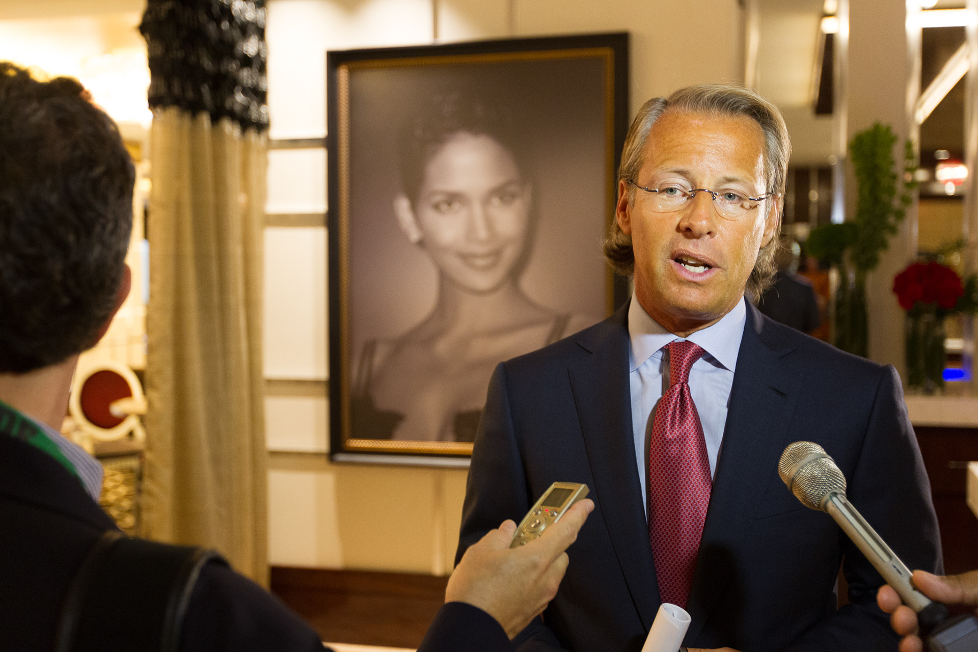 Nathan Forbes, a principal with Rock Gaming, speaks with reporters prior to the opening of Cleveland's Horseshoe Casino. Halle Berry's image hangs in the VIP lounge entrance along with those of other famous Clevelanders.