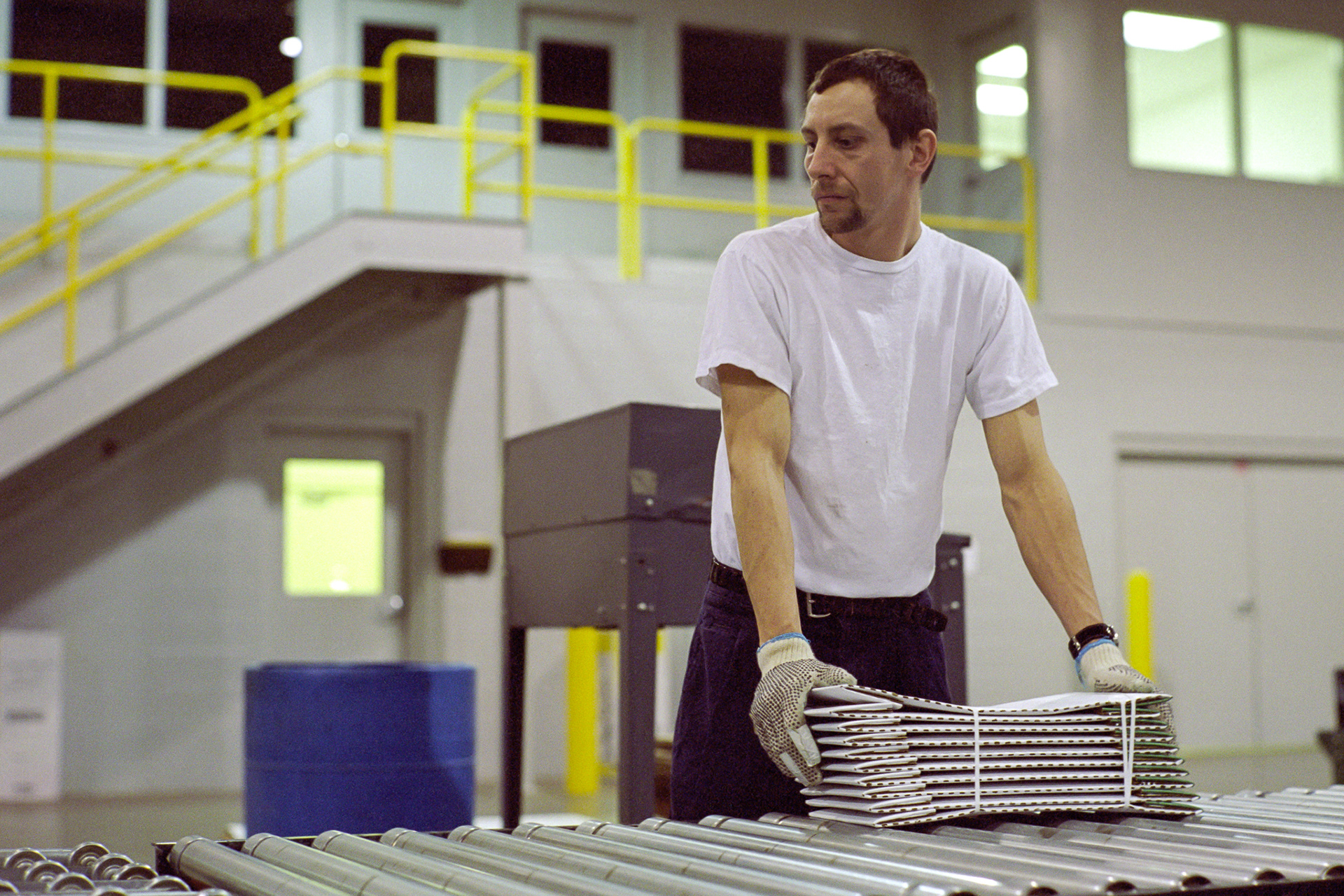 Don takes a breather from stacking cartons as more product comes off the line.