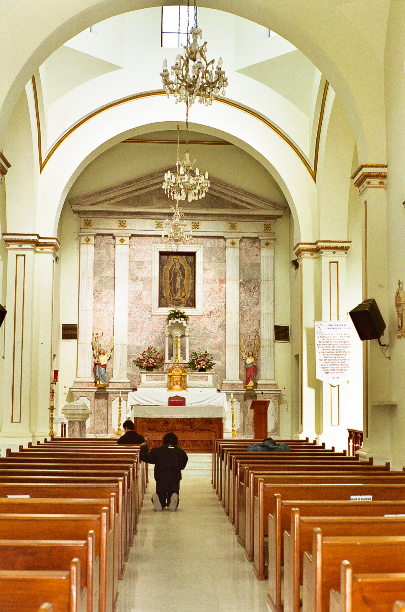 Migrants pray in the church at Altar prior to connecting with their smugglers (coyotes) who will guide them through the desert for a price.