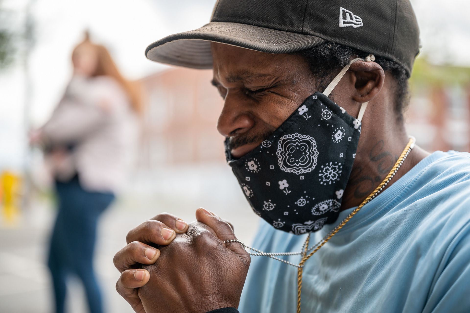 Victor Jester of Bellingham, Wash., weeps in front of the George Floyd vigil at the Bellingham Library.