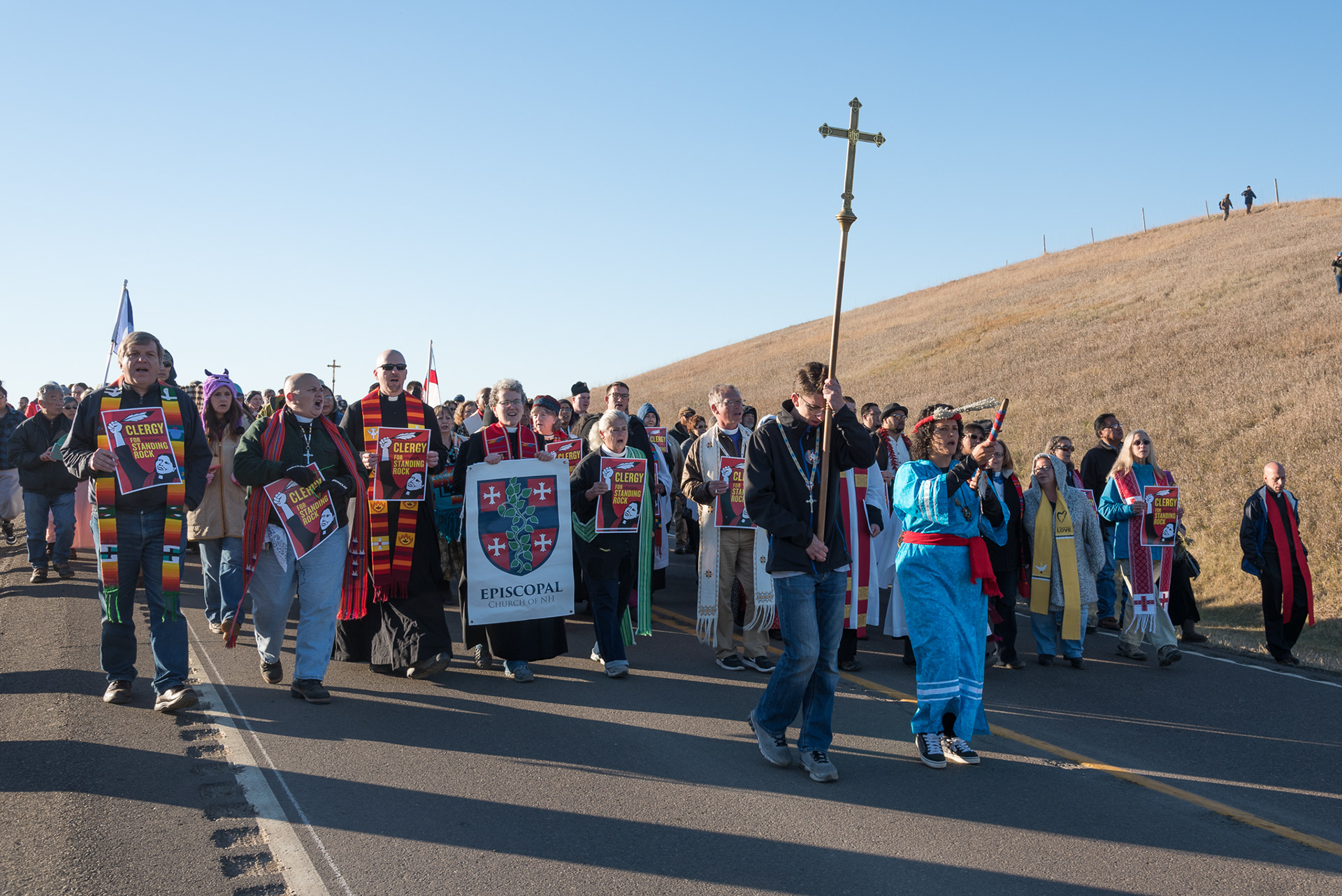 Clergy and Native leaders process from the Oceti Sakowin camp to Backwater Bridge in a show of solidarity with Standing Rock Sioux water protectors contesting the construction of the Dakota Access Pipeline near Cannon Ball, North Dakota.