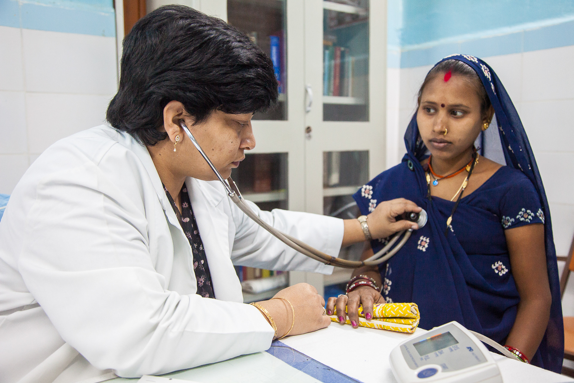 Dr. Teresa Henry performs and intake checkup on an expectant mother at the Christian Hospital, Mungeli, India.